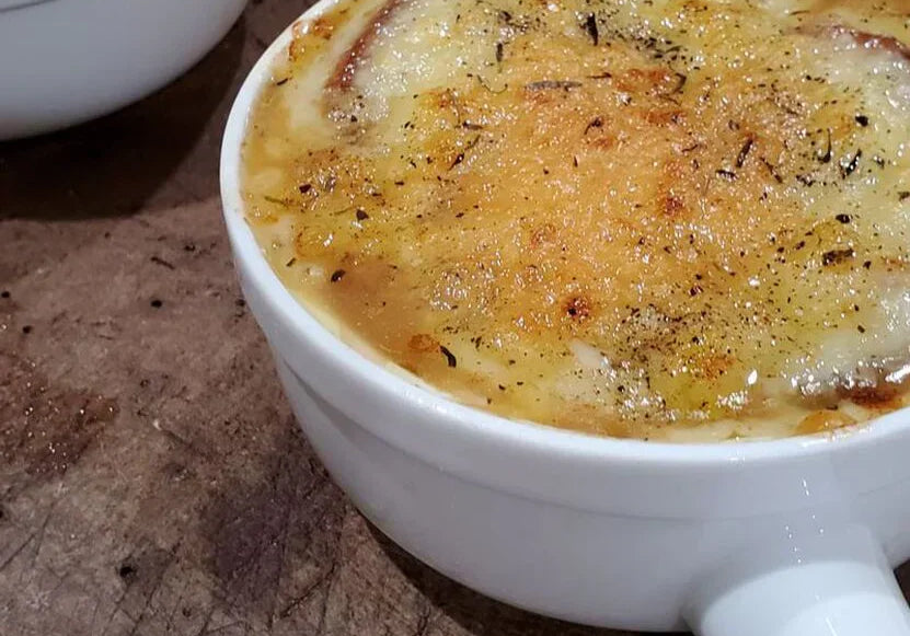 white French crocks of gooey, cheesy French onion soup