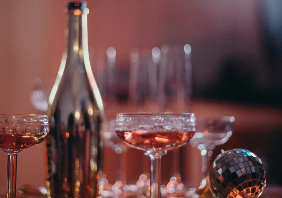 Bottle of champagne and coupe glasses