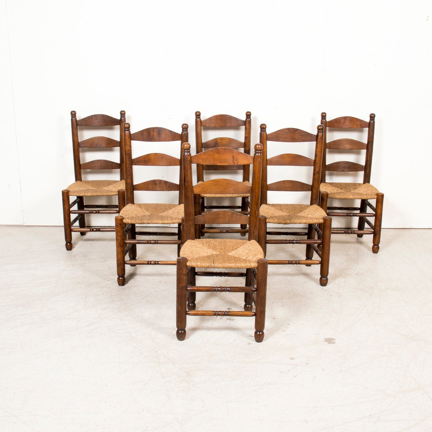 Set of Six 19th Century French Ladderback Walnut Chairs with Rush Seats From Normandy