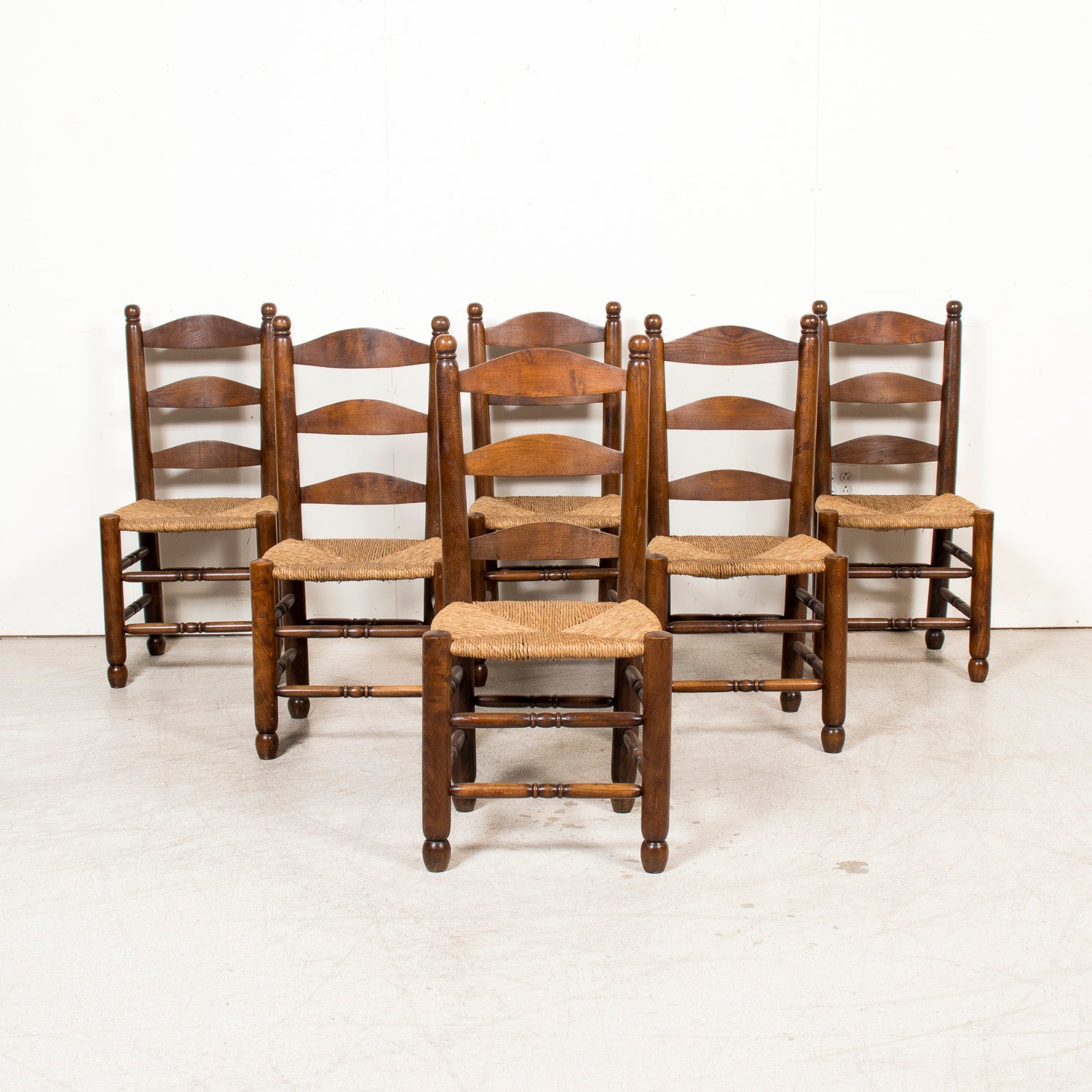 Set of Six 19th Century French Ladderback Walnut Chairs with Rush Seats From Normandy
