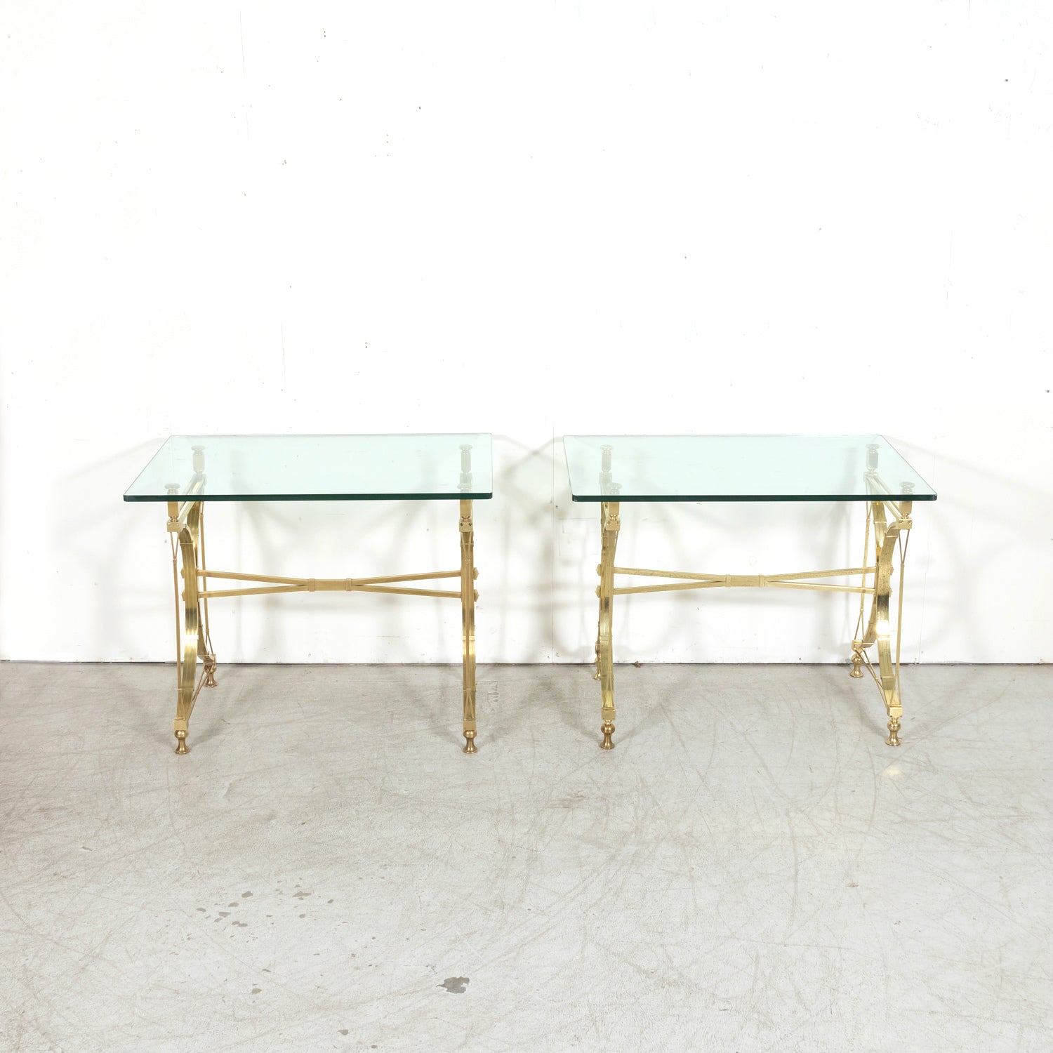 Pair of Mid-20th Century French Gilt Brass and Glass Console Tables Attributed to Maison Jansen