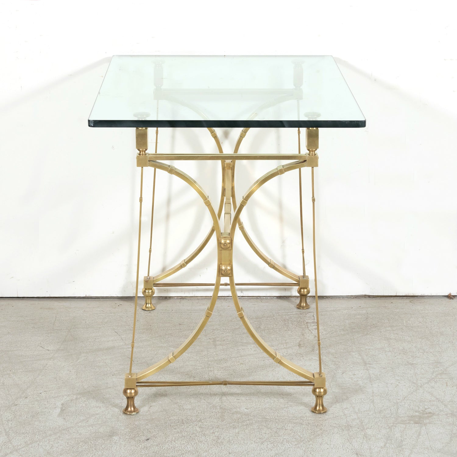 Pair of Mid-20th Century French Gilt Brass and Glass Console Tables Attributed to Maison Jansen