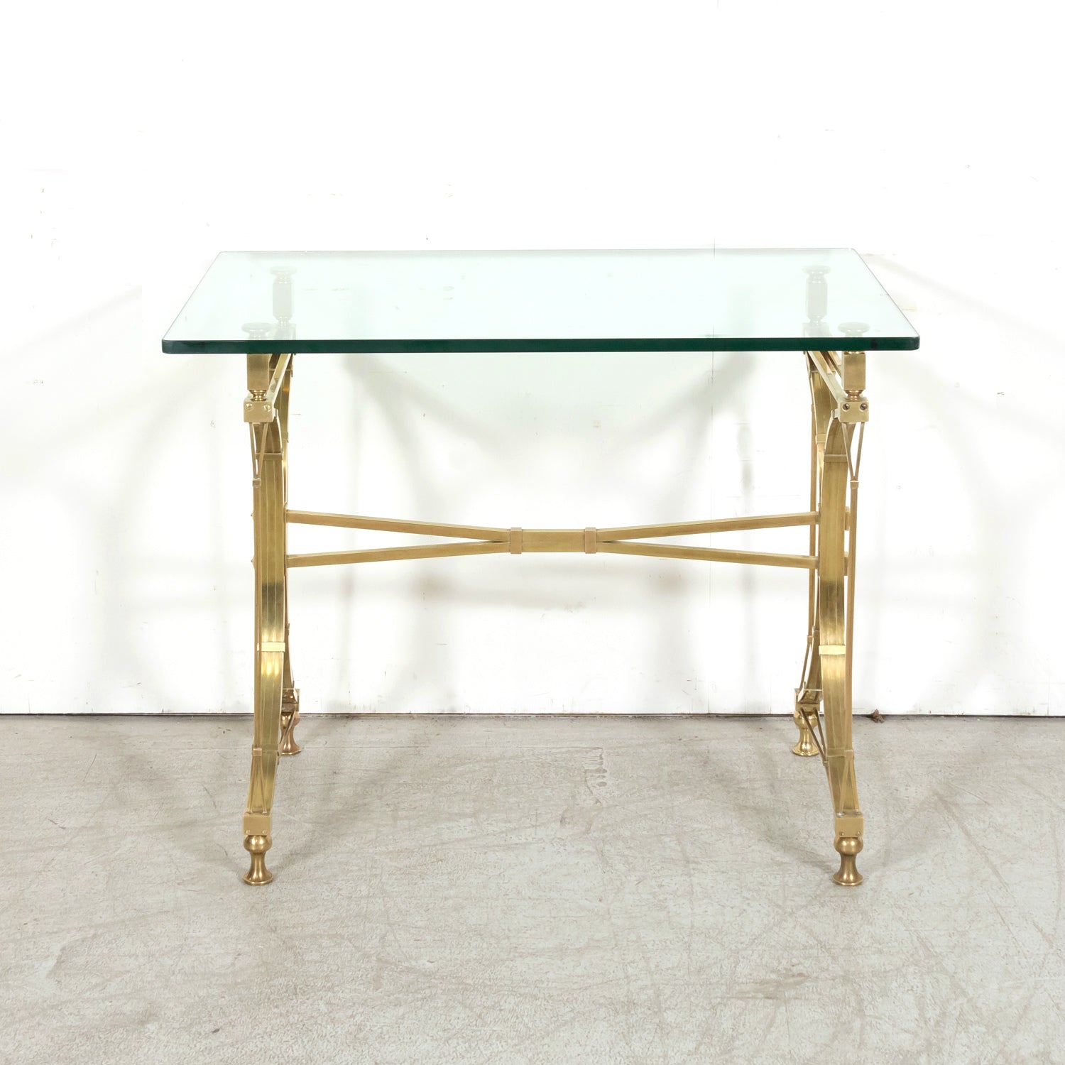Pair of Mid-20th Century French Gilt Brass and Glass Console Tables Attributed to Maison Jansen