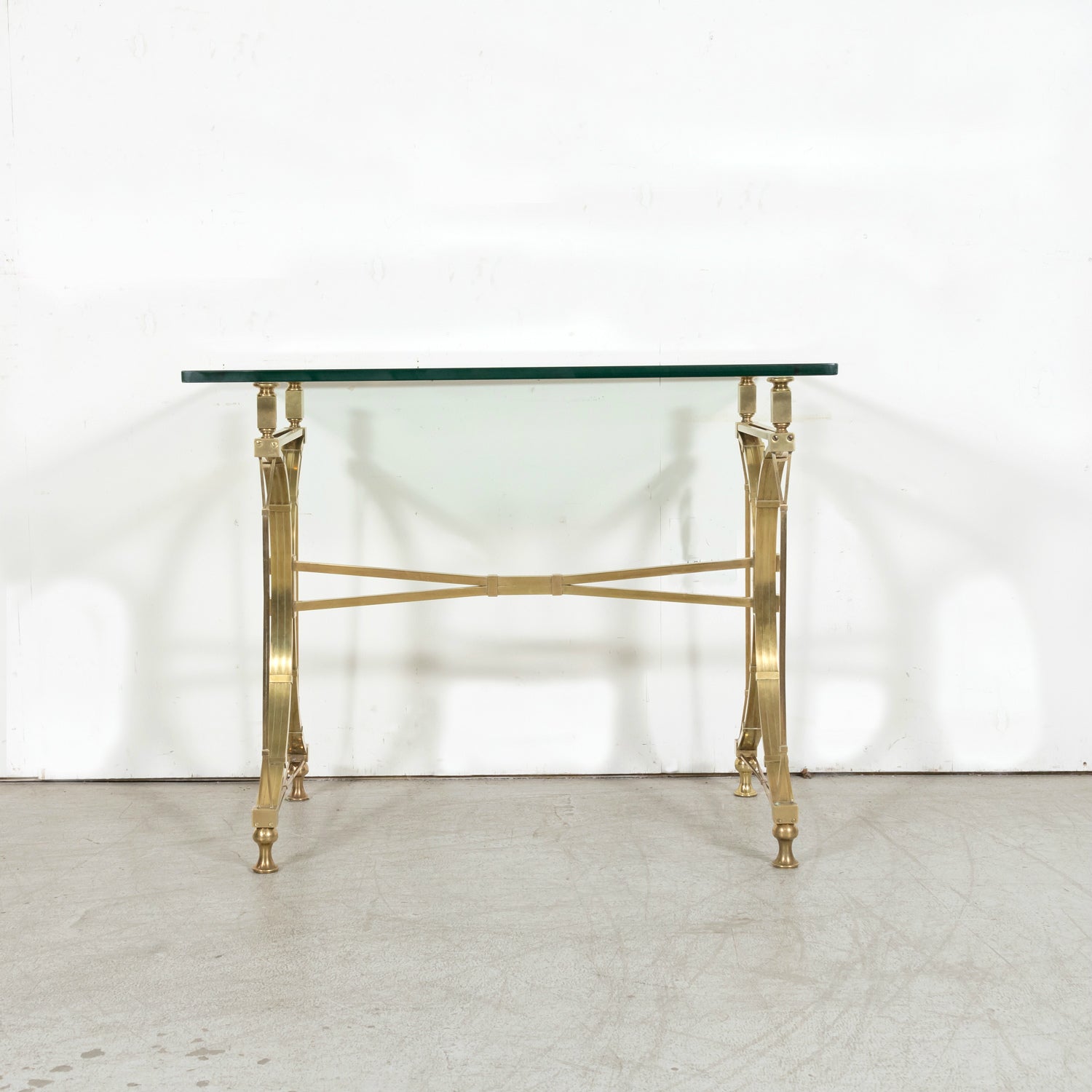 Pair of Mid-20th Century French Gilt Brass and Glass Console Tables Attributed to Maison Jansen