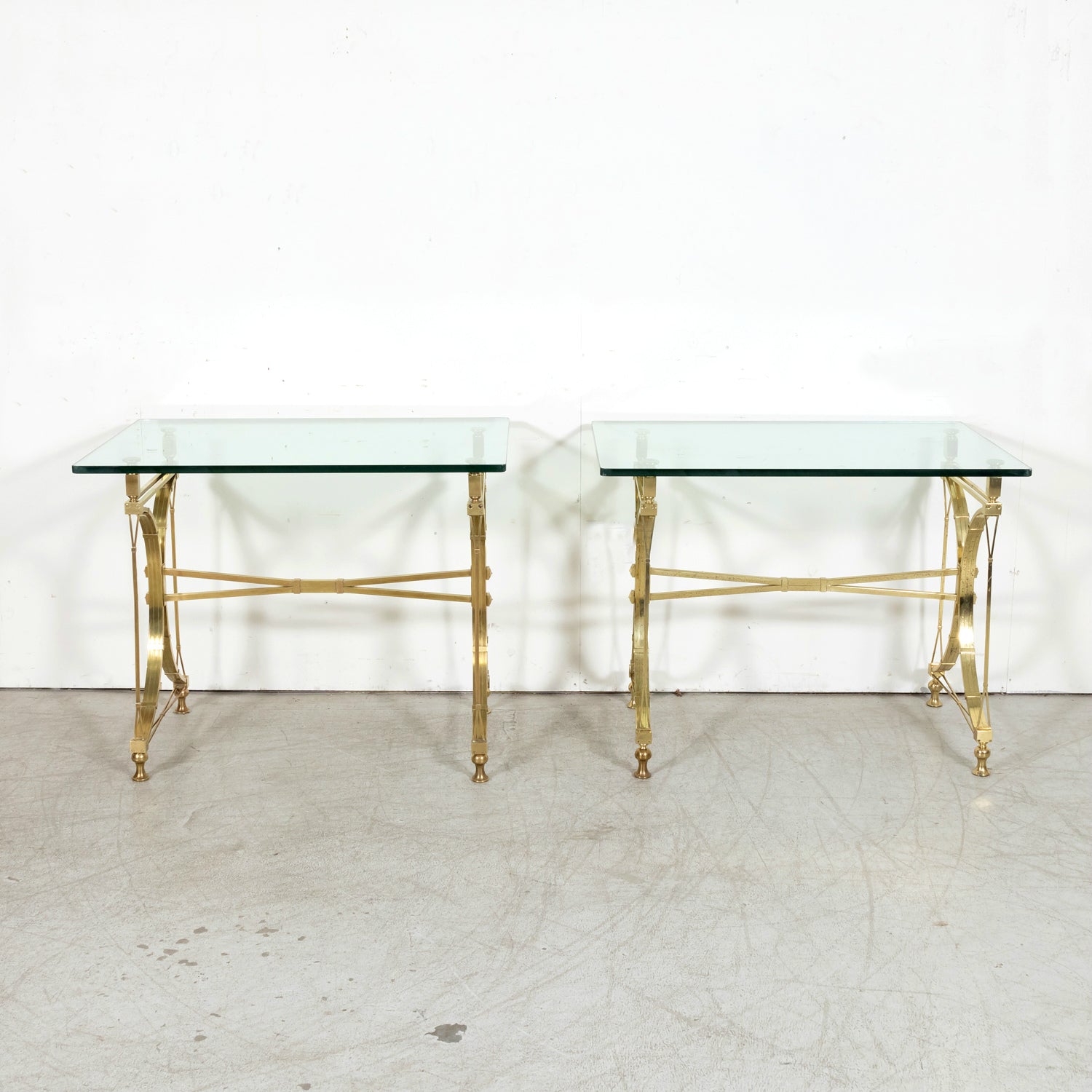 Pair of Mid-20th Century French Gilt Brass and Glass Console Tables Attributed to Maison Jansen