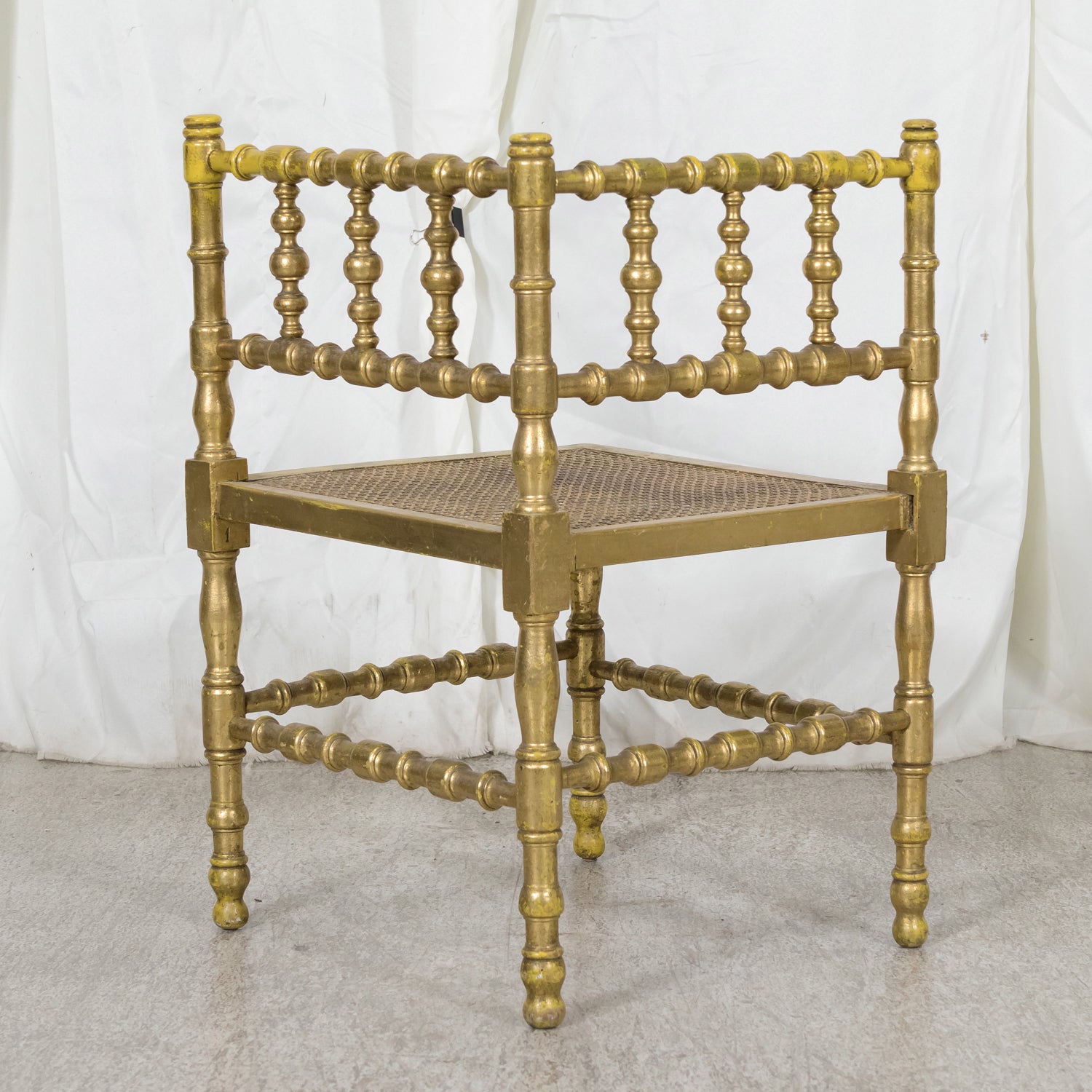 Early 20th Century French Carved Faux Bamboo Painted and Parcel Gilt Corner Chair with Cane Seat