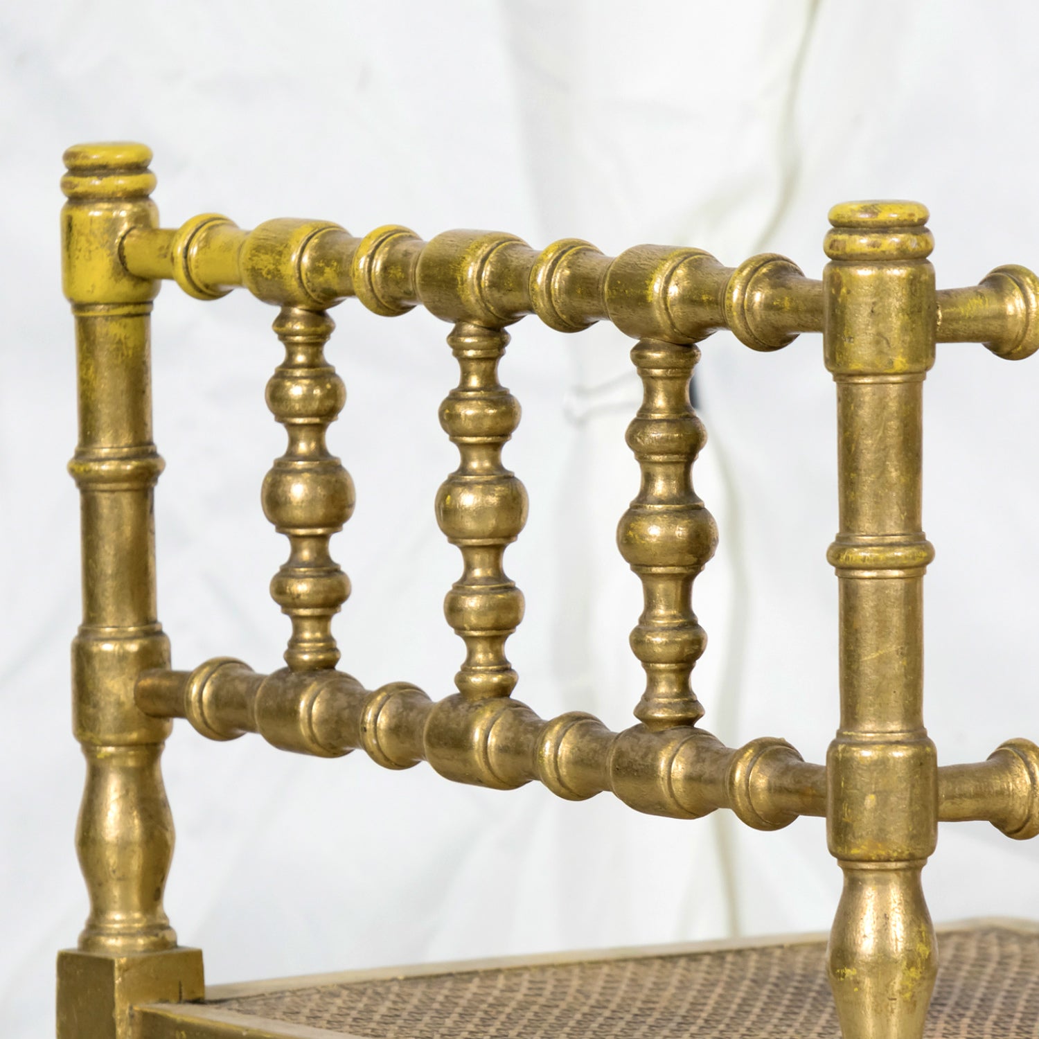 Early 20th Century French Carved Faux Bamboo Painted and Parcel Gilt Corner Chair with Cane Seat