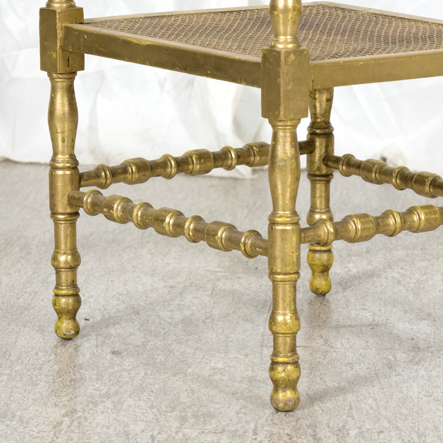 Early 20th Century French Carved Faux Bamboo Painted and Parcel Gilt Corner Chair with Cane Seat