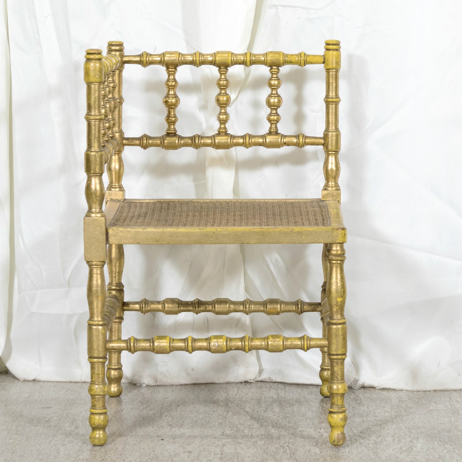 Early 20th Century French Carved Faux Bamboo Painted and Parcel Gilt Corner Chair with Cane Seat