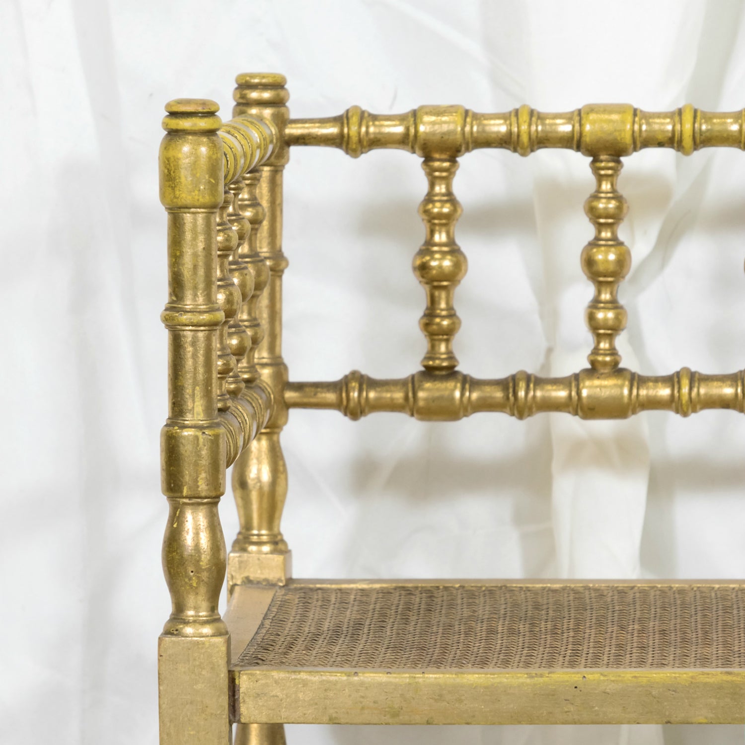 Early 20th Century French Carved Faux Bamboo Painted and Parcel Gilt Corner Chair with Cane Seat