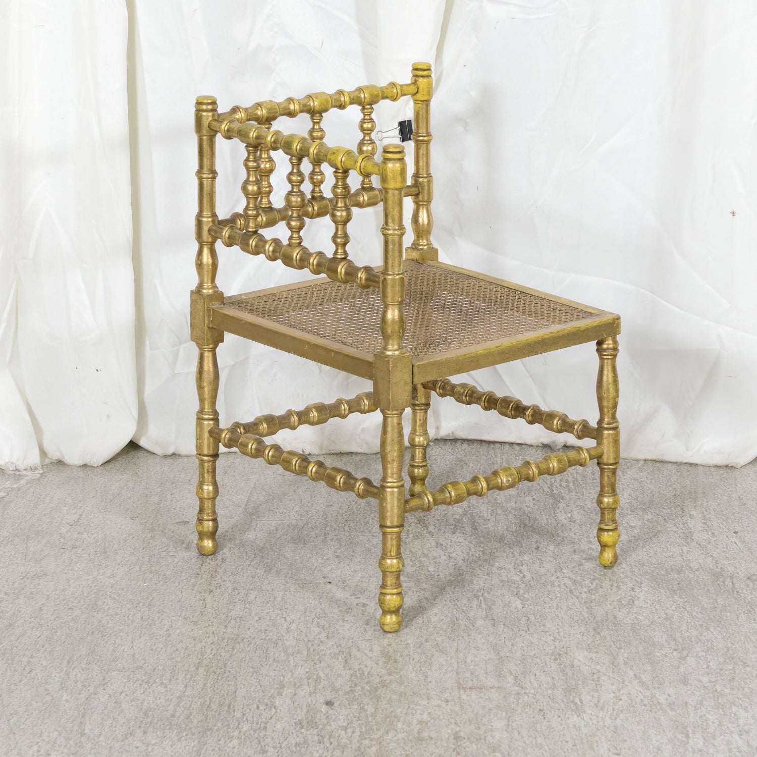 Early 20th Century French Carved Faux Bamboo Painted and Parcel Gilt Corner Chair with Cane Seat