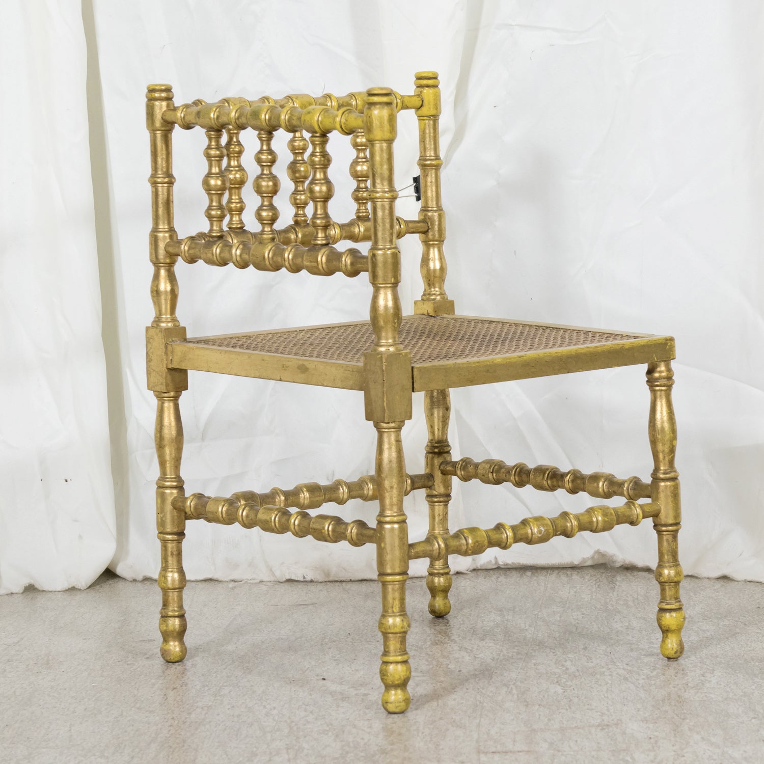 Early 20th Century French Carved Faux Bamboo Painted and Parcel Gilt Corner Chair with Cane Seat