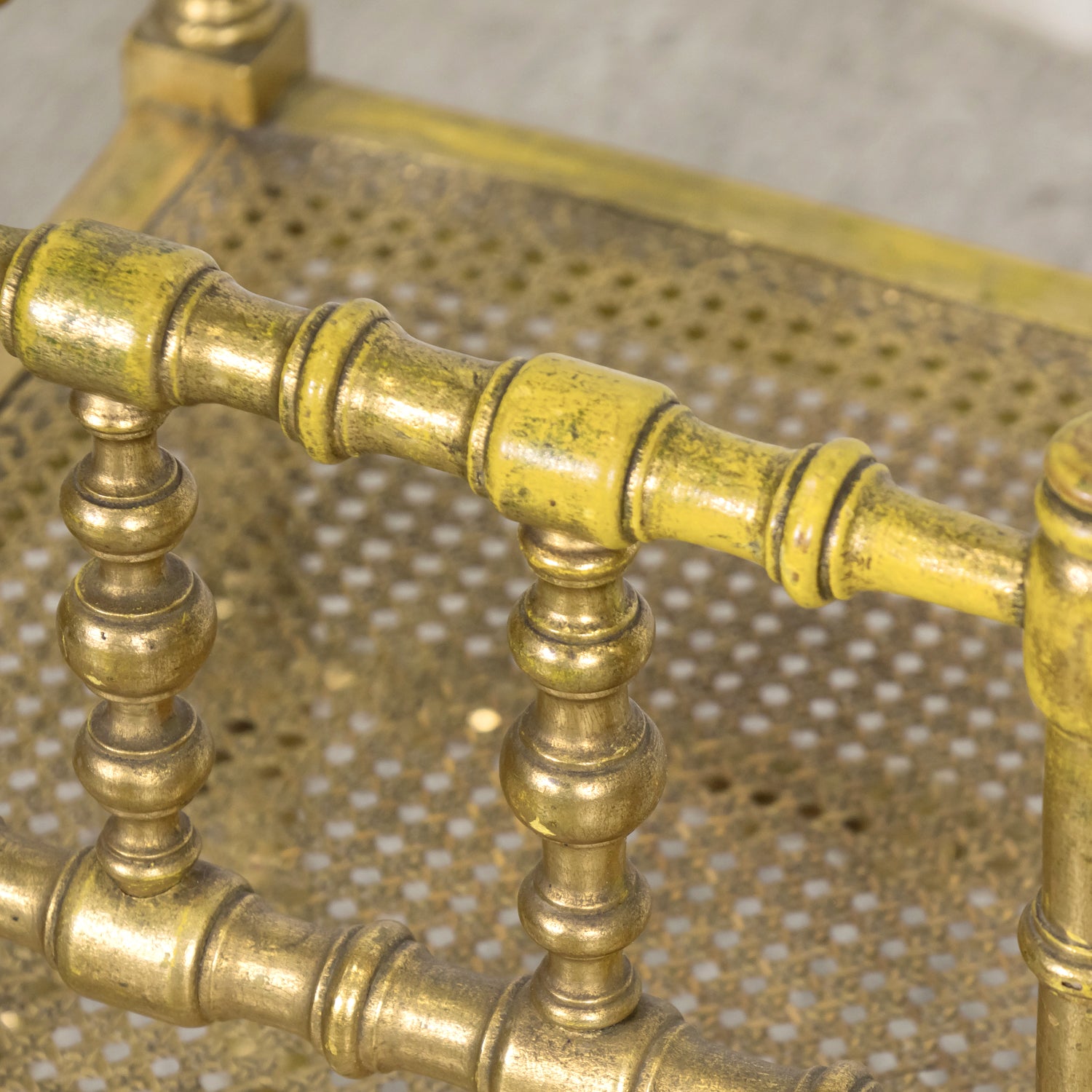 Early 20th Century French Carved Faux Bamboo Painted and Parcel Gilt Corner Chair with Cane Seat