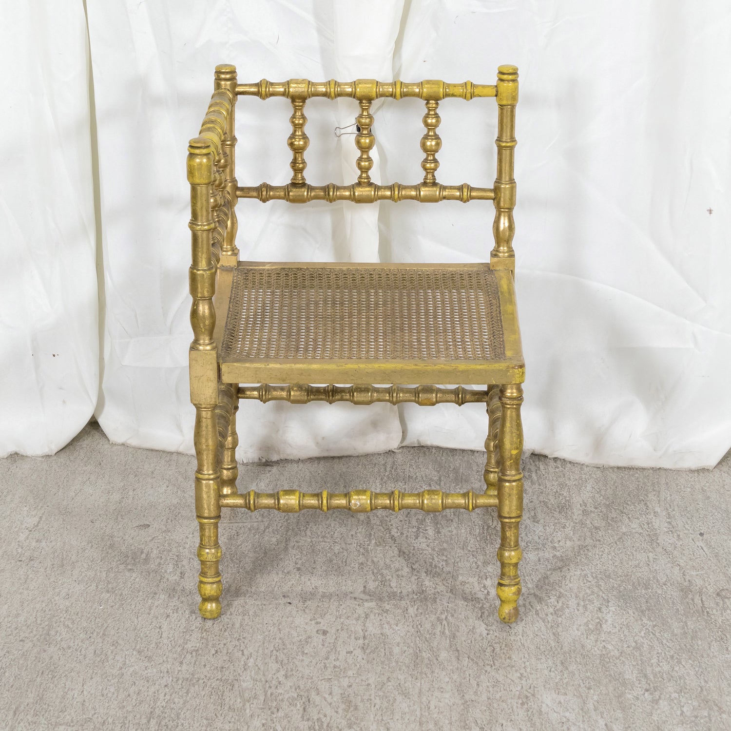 Early 20th Century French Carved Faux Bamboo Painted and Parcel Gilt Corner Chair with Cane Seat
