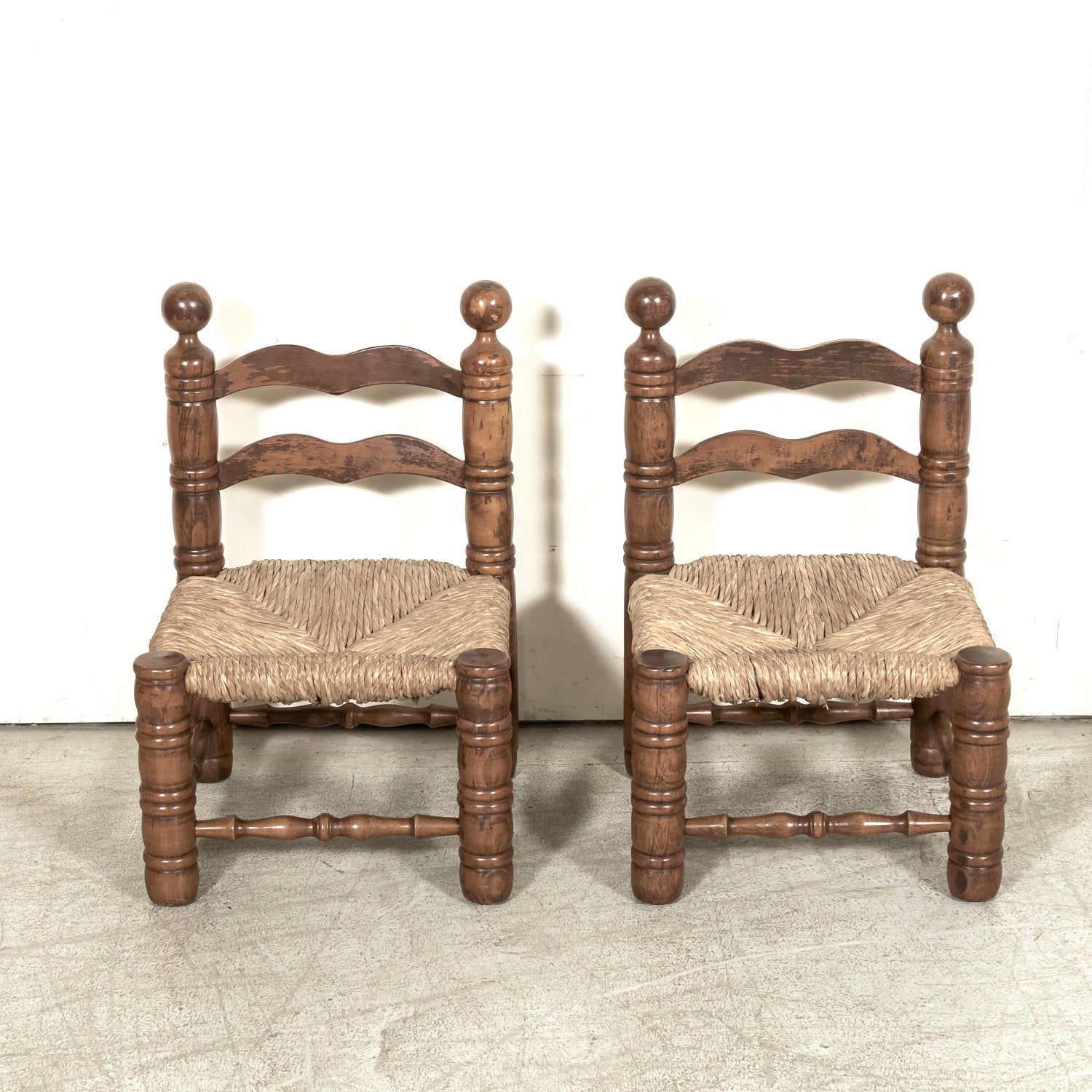 Pair of Mid-20th Century French Brutalist Style Low Rush Seat Fireplace Chairs by Charles Dudouyt