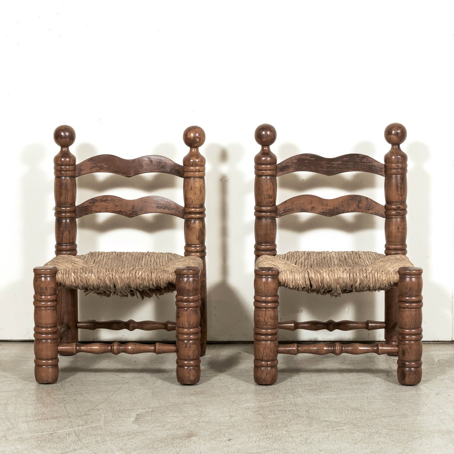 Pair of Mid-20th Century French Brutalist Style Low Rush Seat Fireplace Chairs by Charles Dudouyt