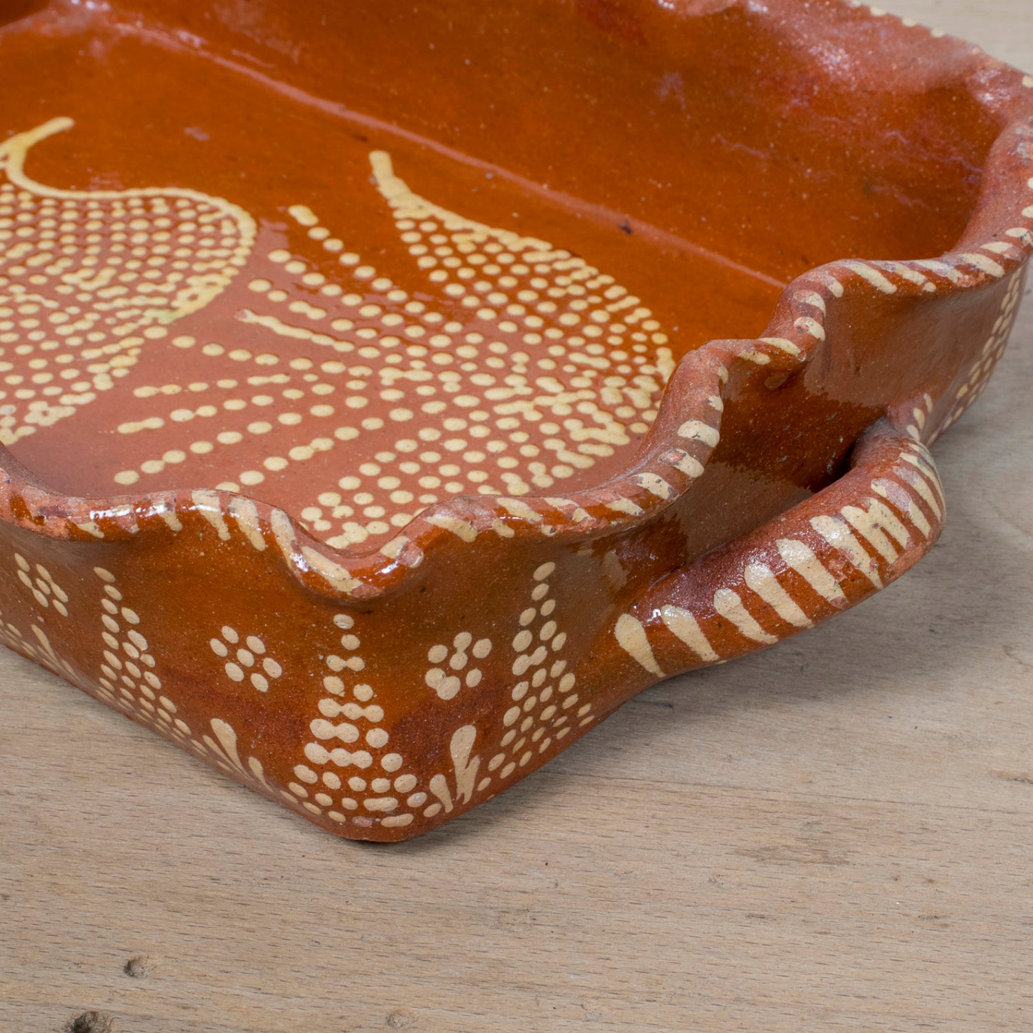 19th Century Portuguese Red Slipware Baking Dish with Tulip Design and Ruffled Edge