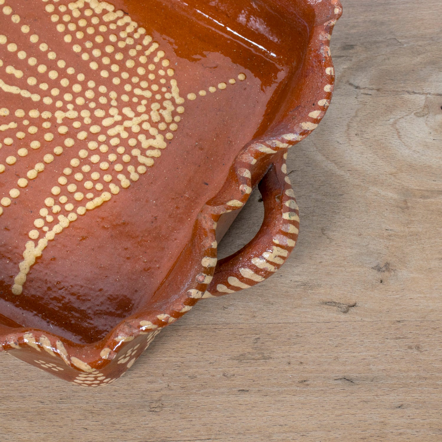 19th Century Portuguese Red Slipware Baking Dish with Tulip Design and Ruffled Edge