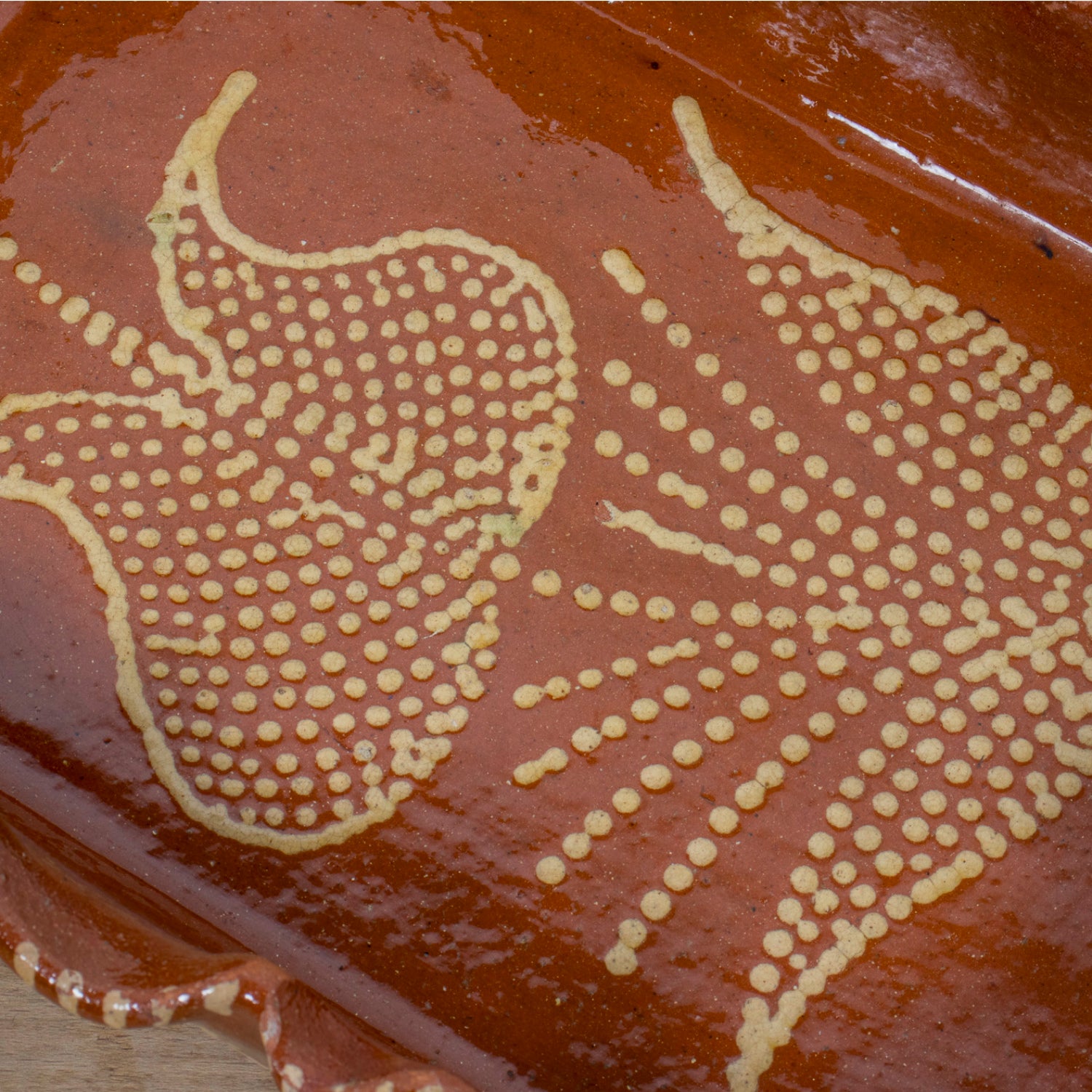 19th Century Portuguese Red Slipware Baking Dish with Tulip Design and Ruffled Edge