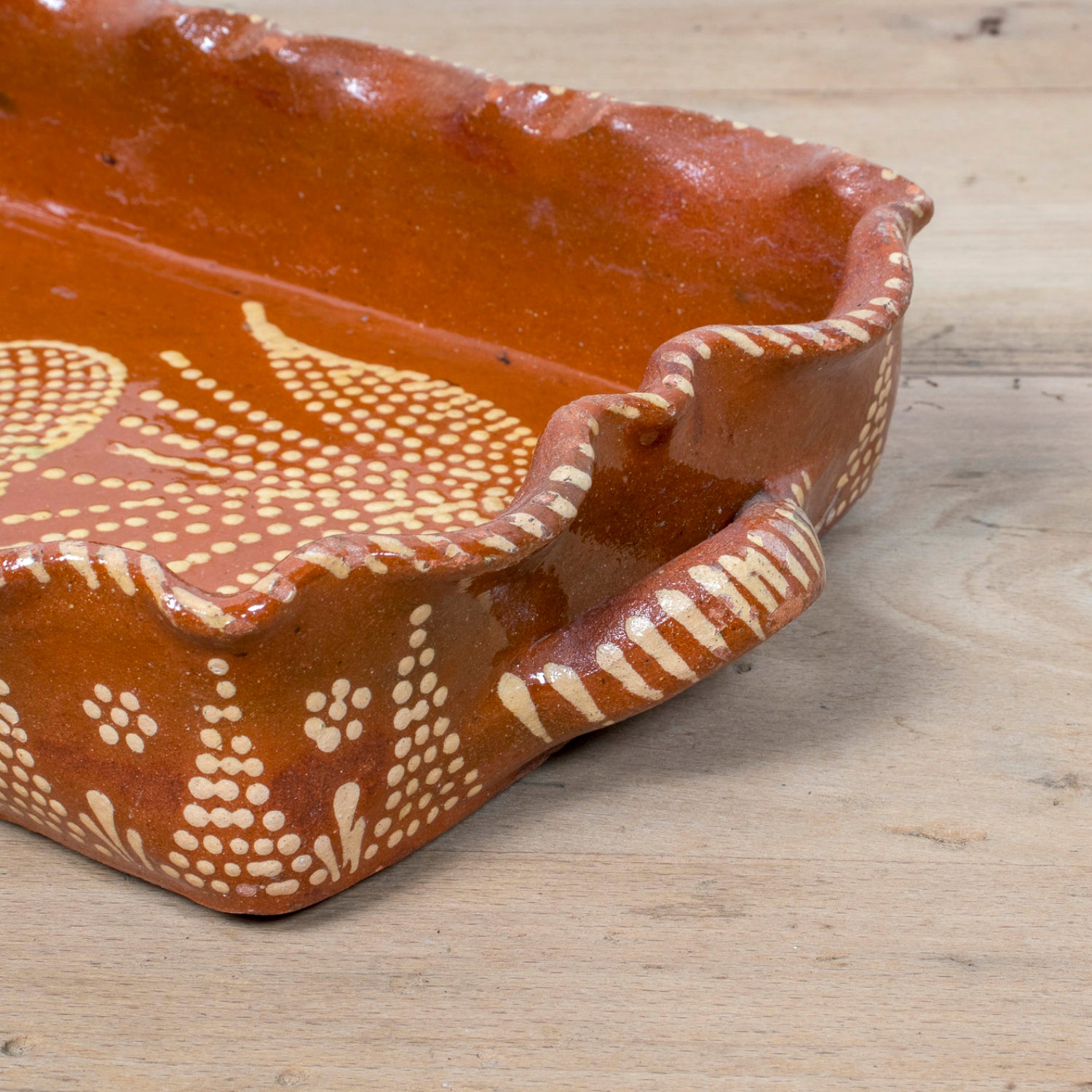 19th Century Portuguese Red Slipware Baking Dish with Tulip Design and Ruffled Edge