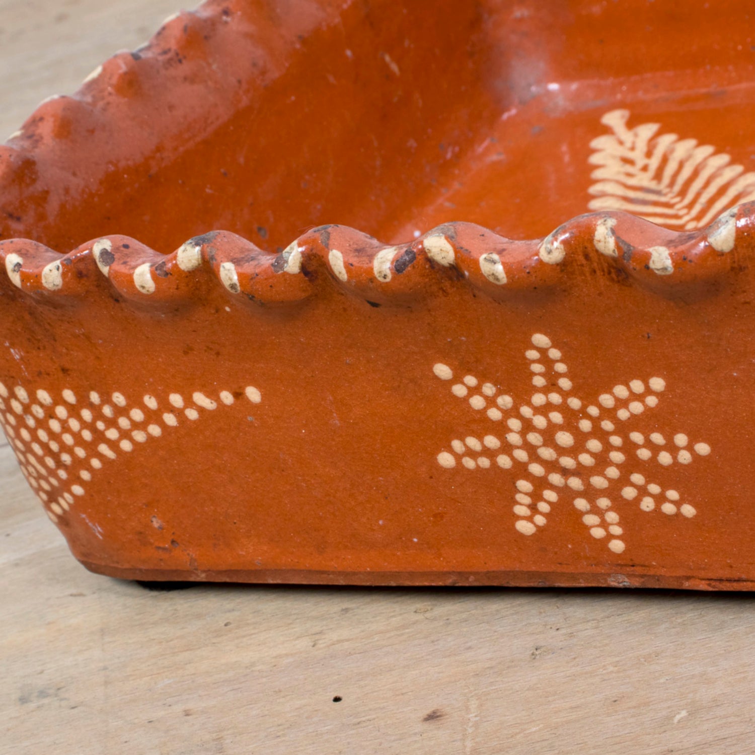19th Century Portuguese Red Slipware Baking Dish with Fern Leaf Design and Ruffled Edge