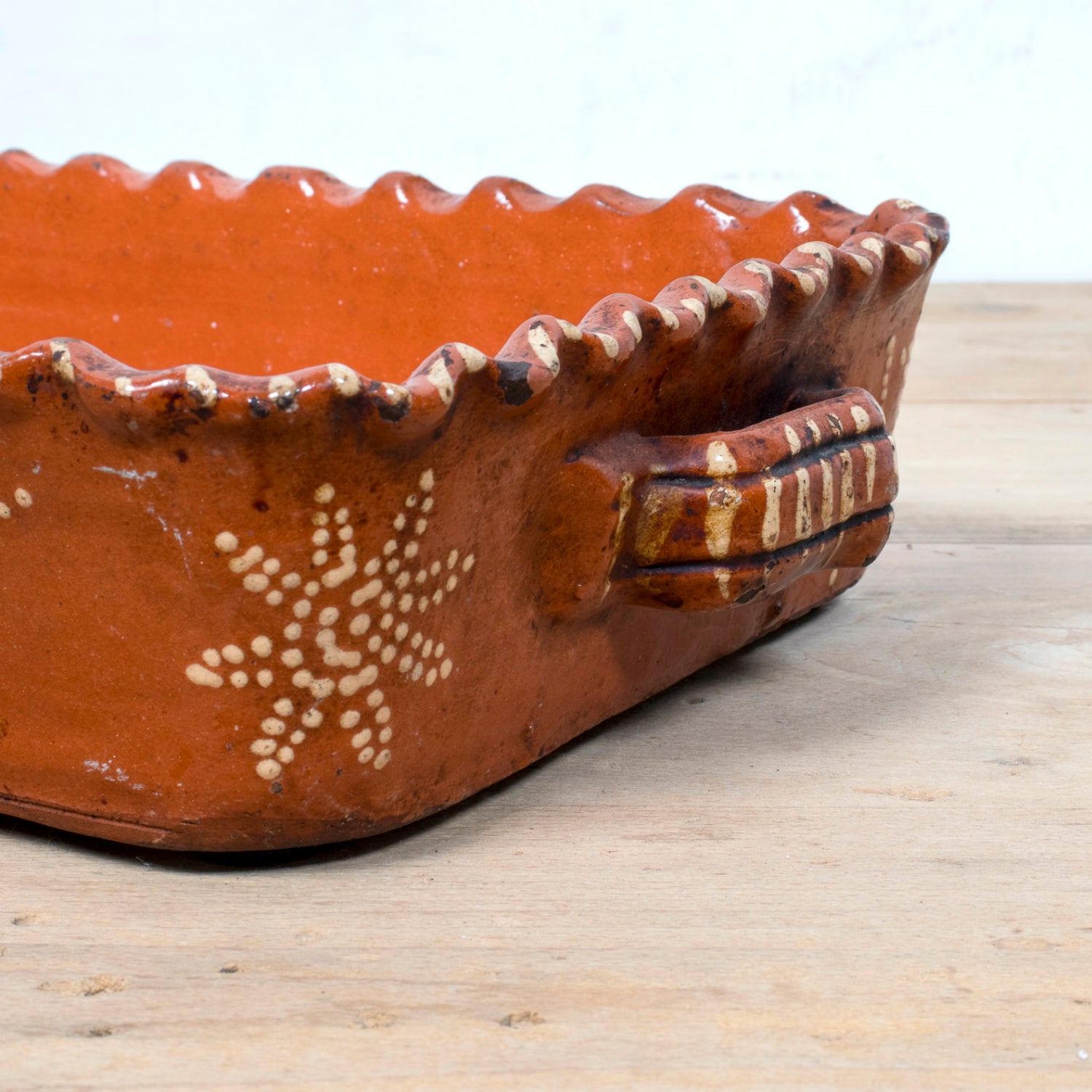 19th Century Portuguese Red Slipware Baking Dish with Fern Leaf Design and Ruffled Edge