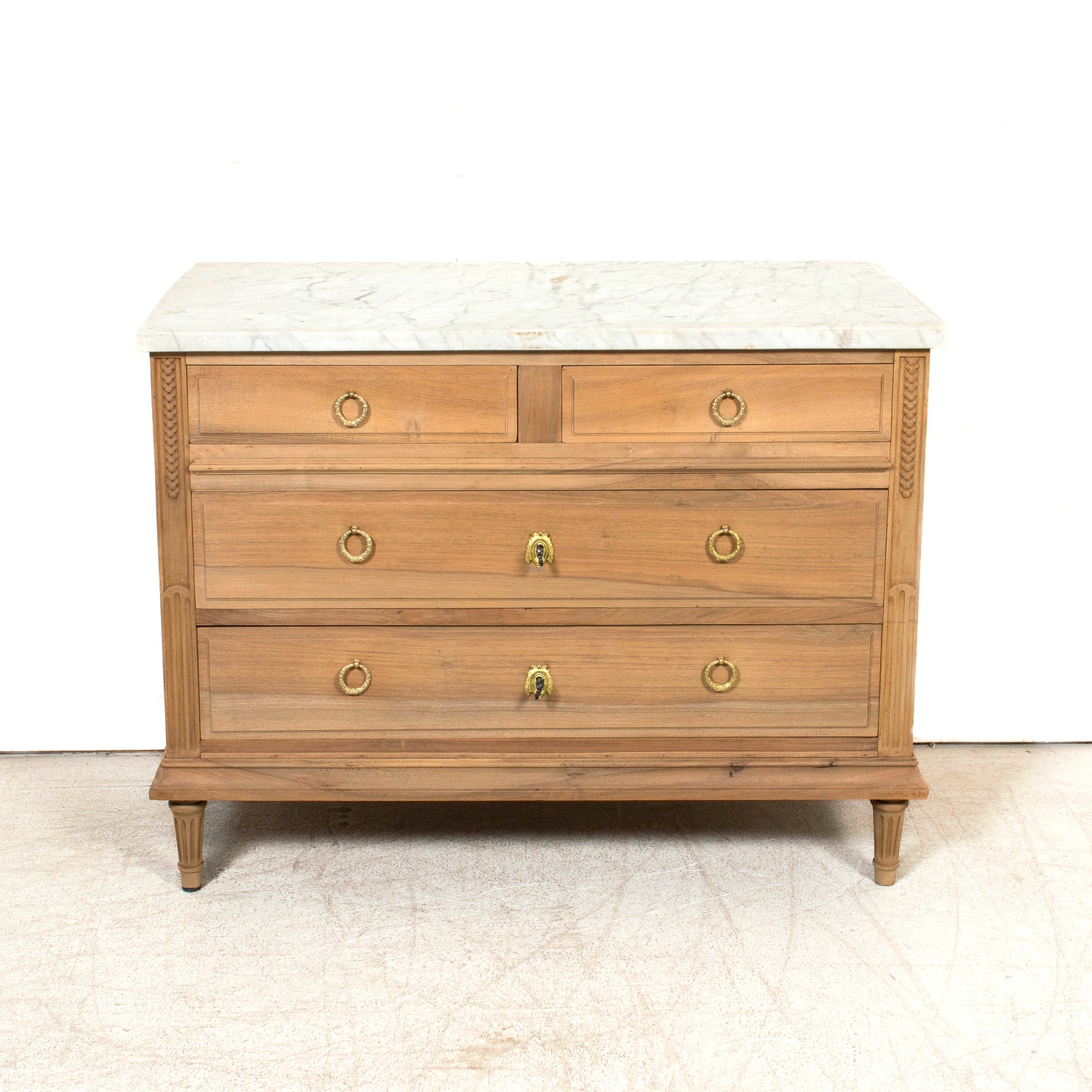 Early 20th Century French Louis XVI Style Bleached Walnut Four-Drawer Commode with Carrara Marble Top