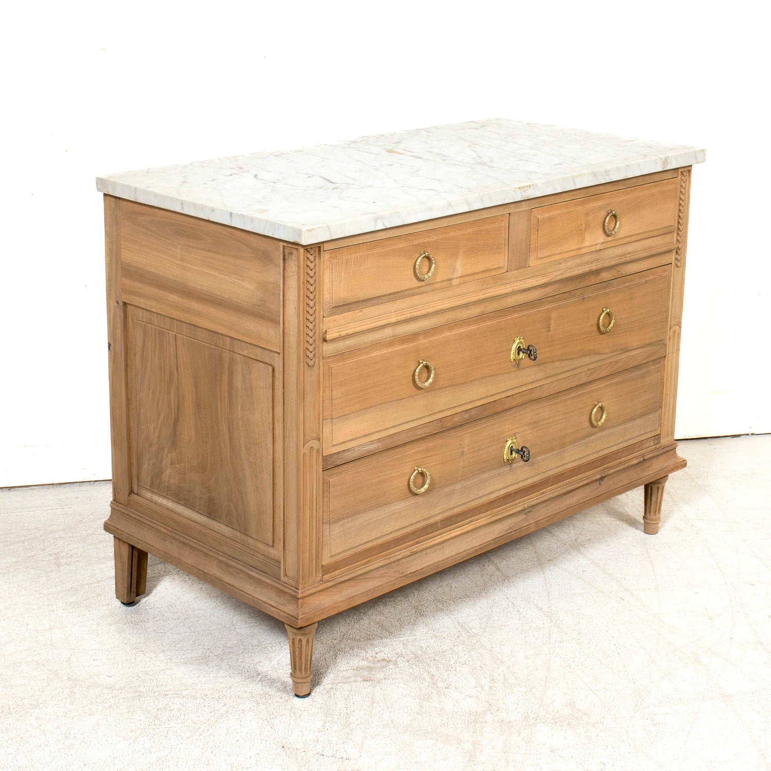Early 20th Century French Louis XVI Style Bleached Walnut Four-Drawer Commode with Carrara Marble Top