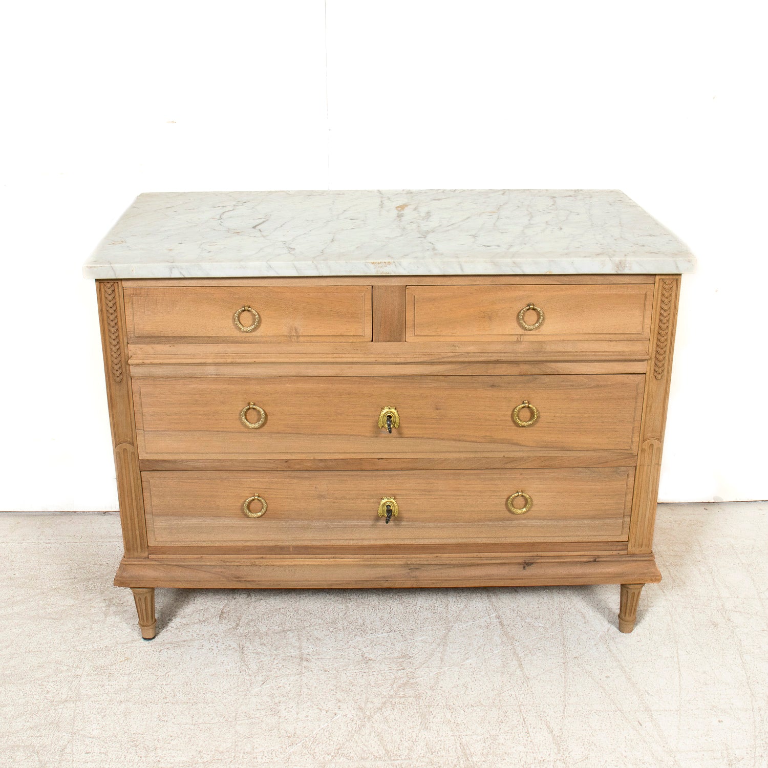 Early 20th Century French Louis XVI Style Bleached Walnut Four-Drawer Commode with Carrara Marble Top