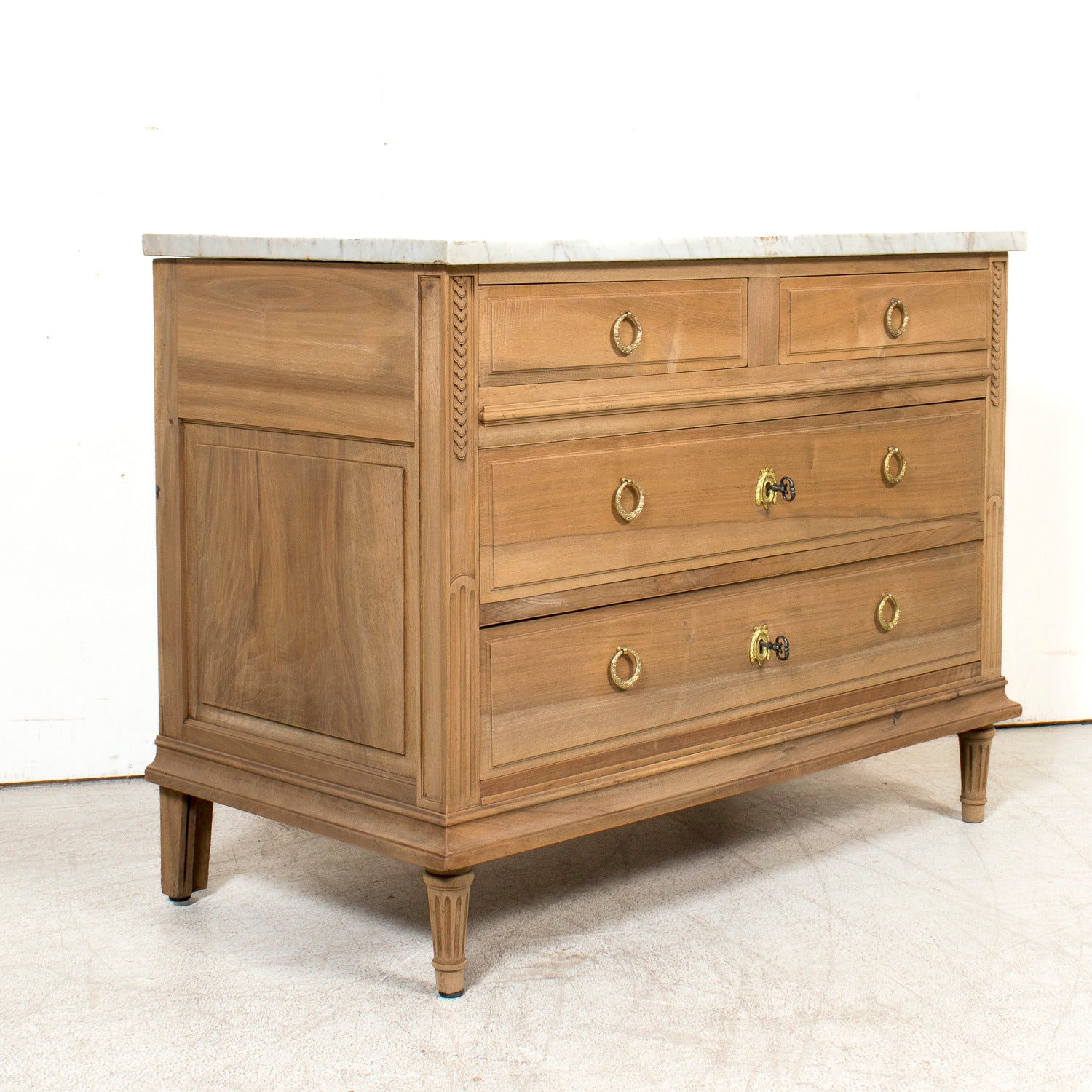 Early 20th Century French Louis XVI Style Bleached Walnut Four-Drawer Commode with Carrara Marble Top