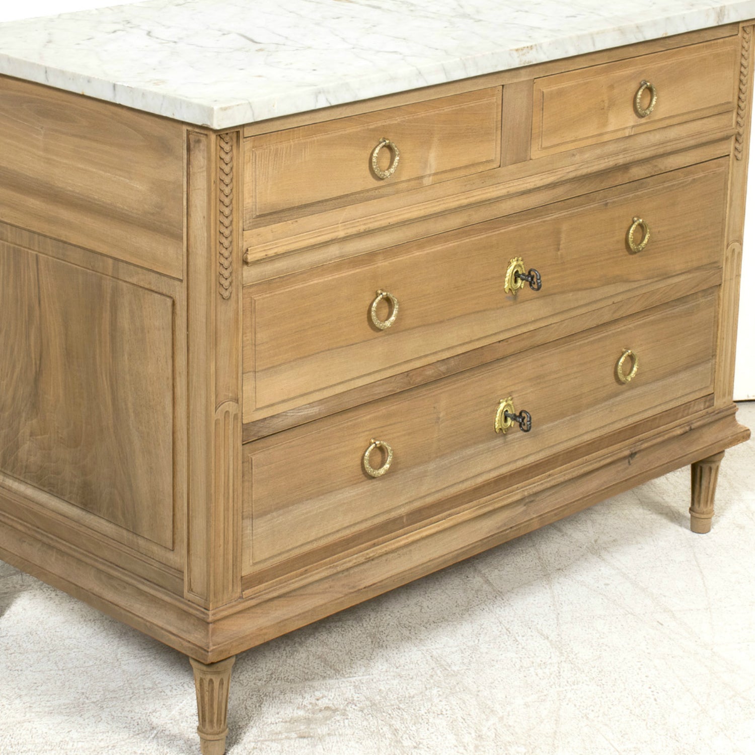 Early 20th Century French Louis XVI Style Bleached Walnut Four-Drawer Commode with Carrara Marble Top