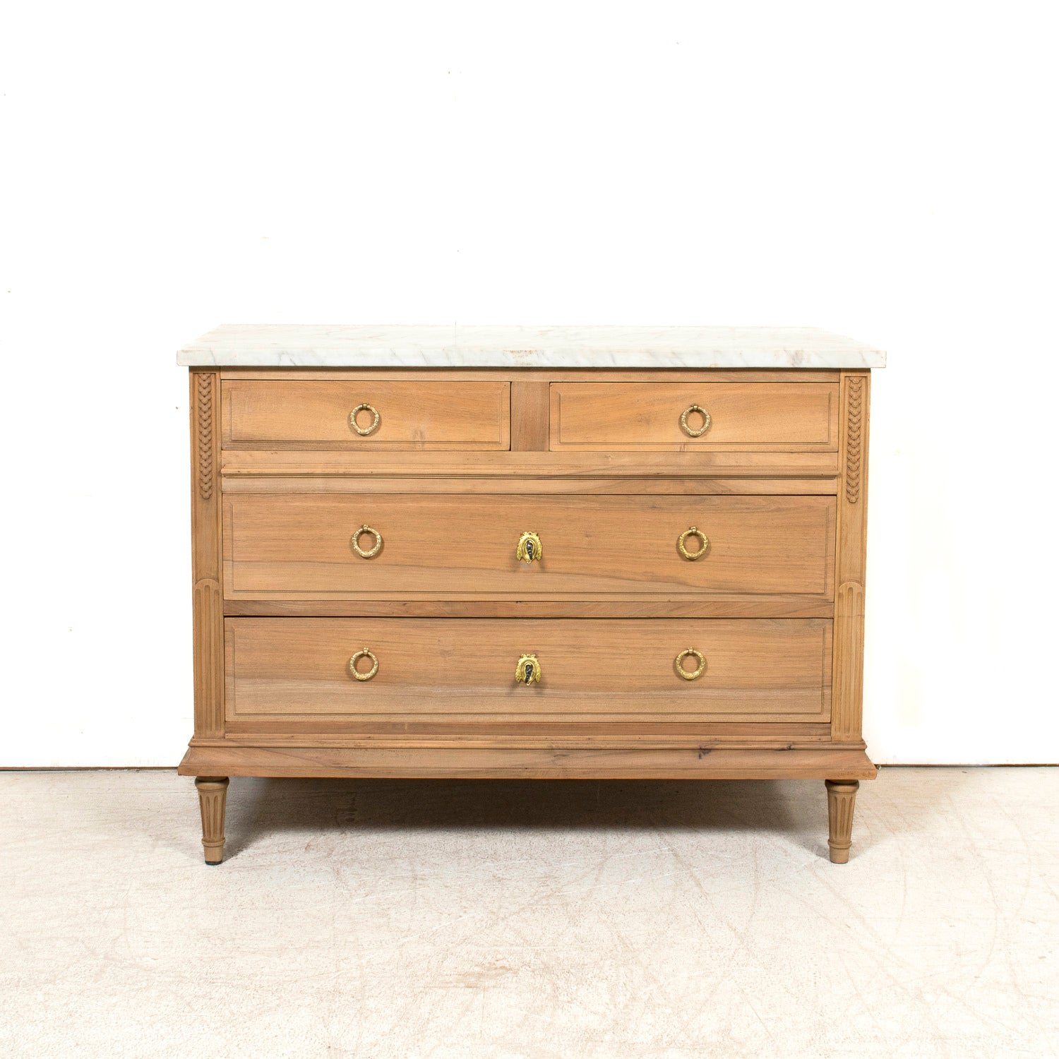Early 20th Century French Louis XVI Style Bleached Walnut Four-Drawer Commode with Carrara Marble Top