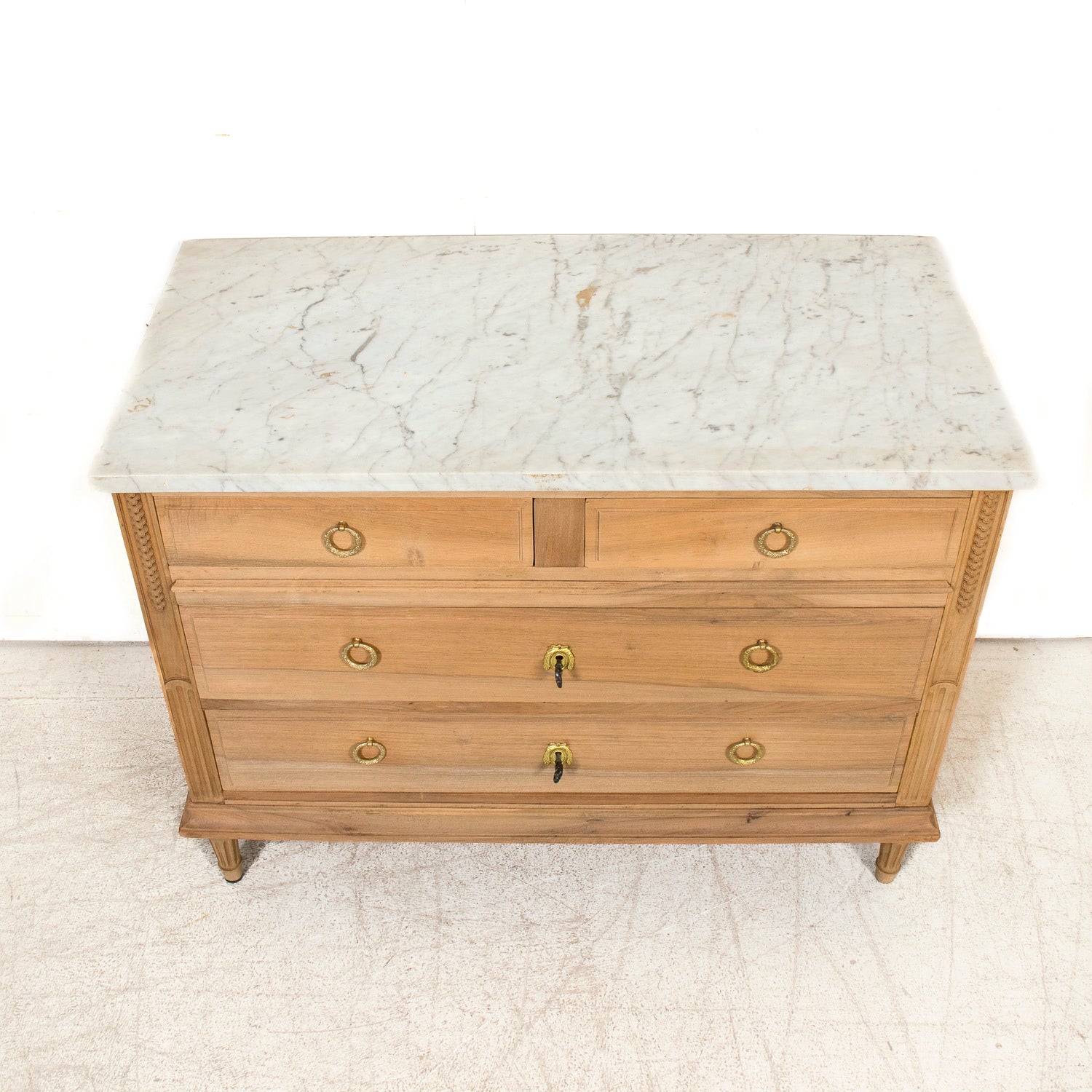 Early 20th Century French Louis XVI Style Bleached Walnut Four-Drawer Commode with Carrara Marble Top