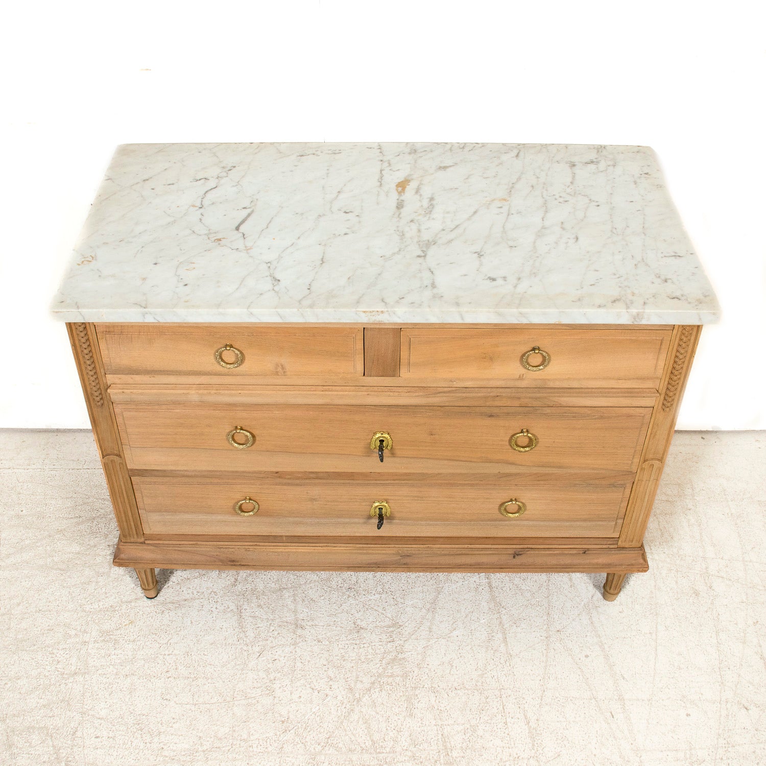 Early 20th Century French Louis XVI Style Bleached Walnut Four-Drawer Commode with Carrara Marble Top