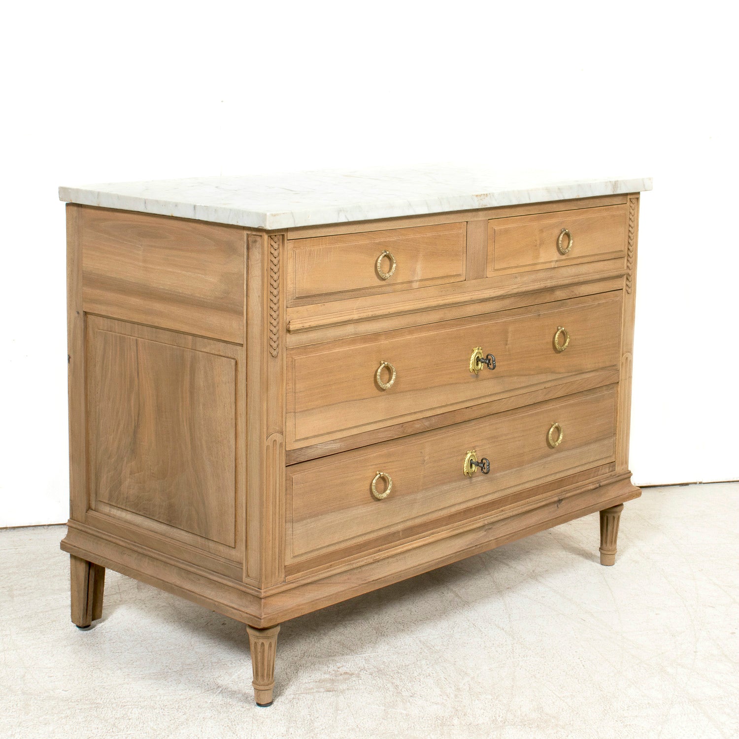 Early 20th Century French Louis XVI Style Bleached Walnut Four-Drawer Commode with Carrara Marble Top