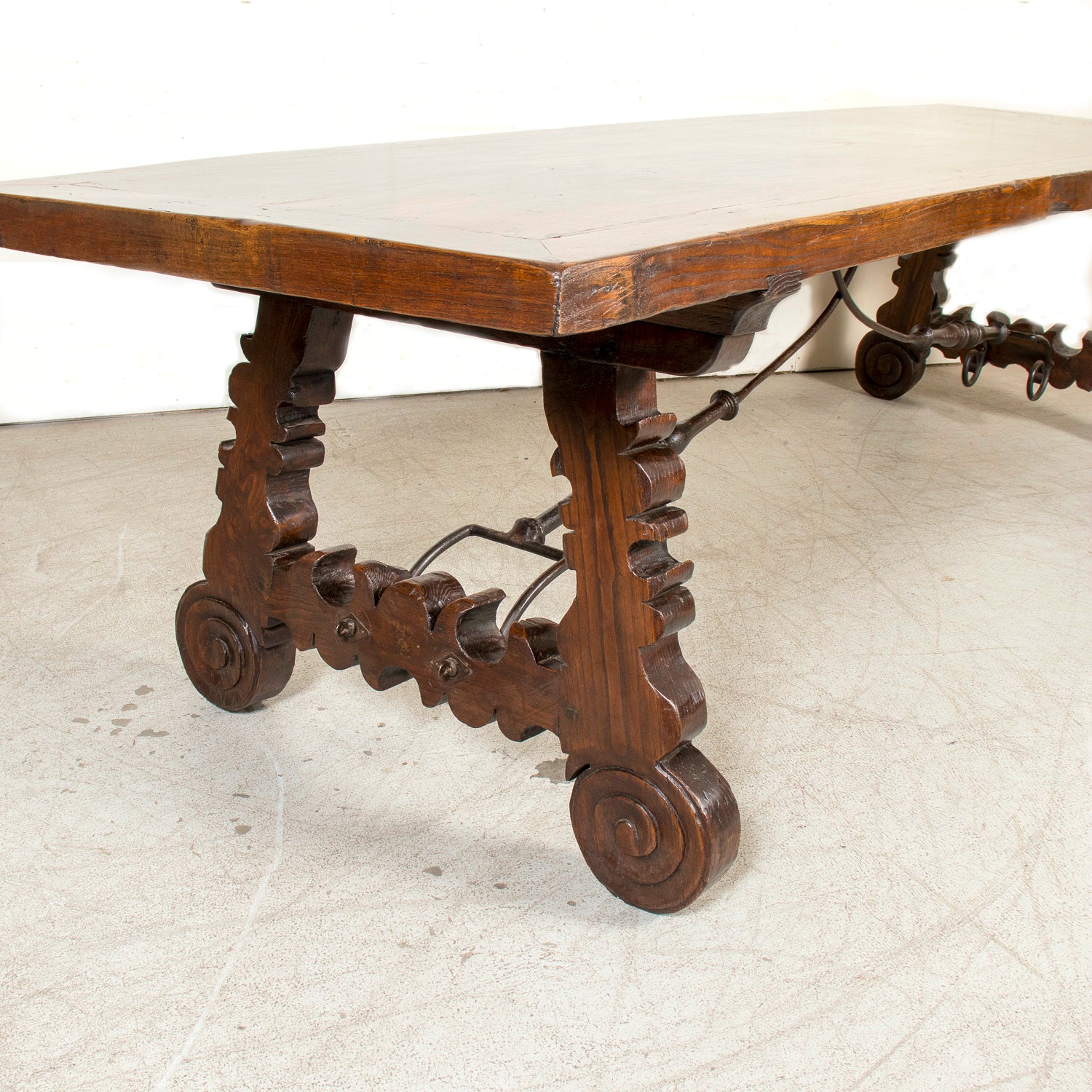 Mid-19th Century Spanish Catalan Carved Oak Dining Trestle Table with Hand Forged Iron Stretcher