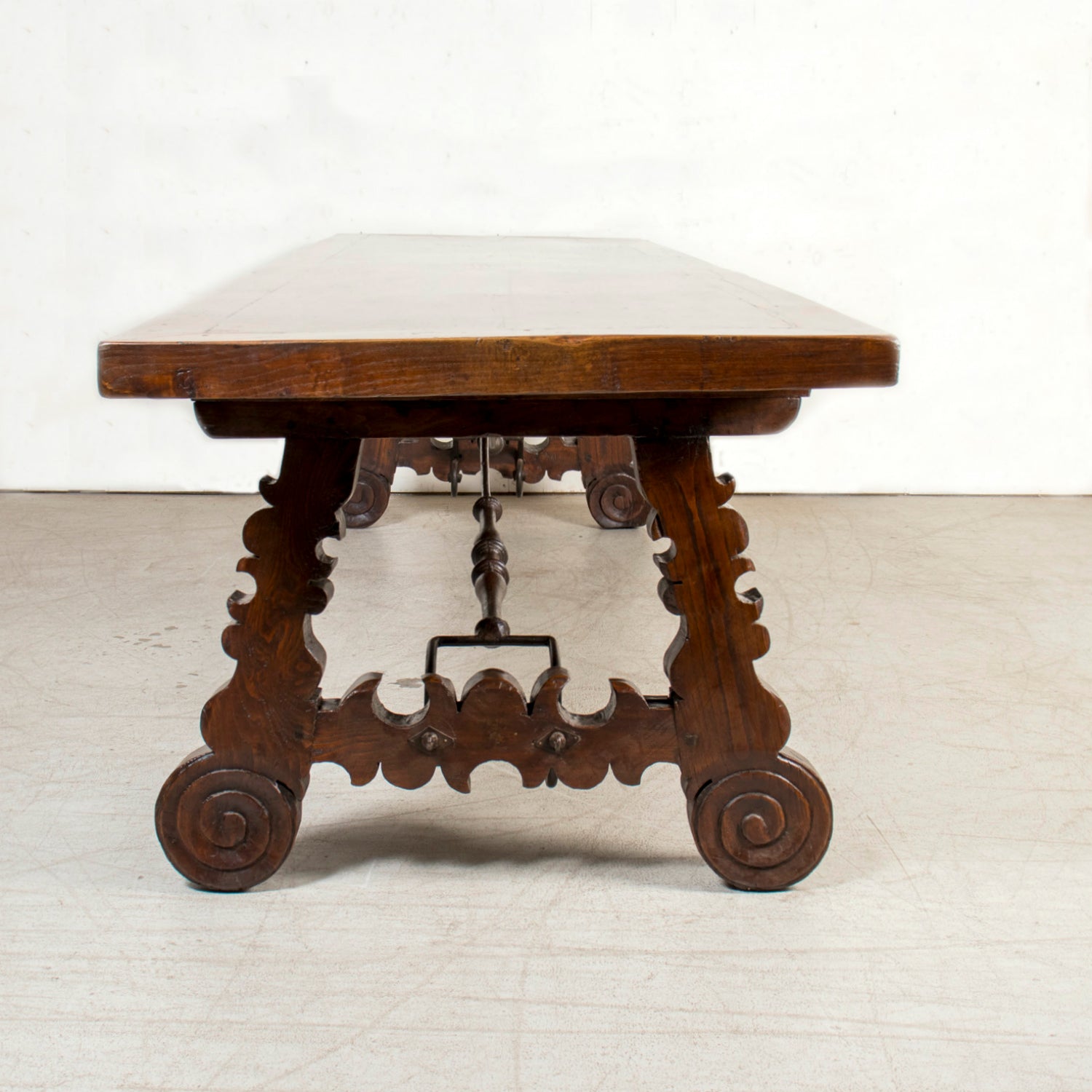 Mid-19th Century Spanish Catalan Carved Oak Dining Trestle Table with Hand Forged Iron Stretcher
