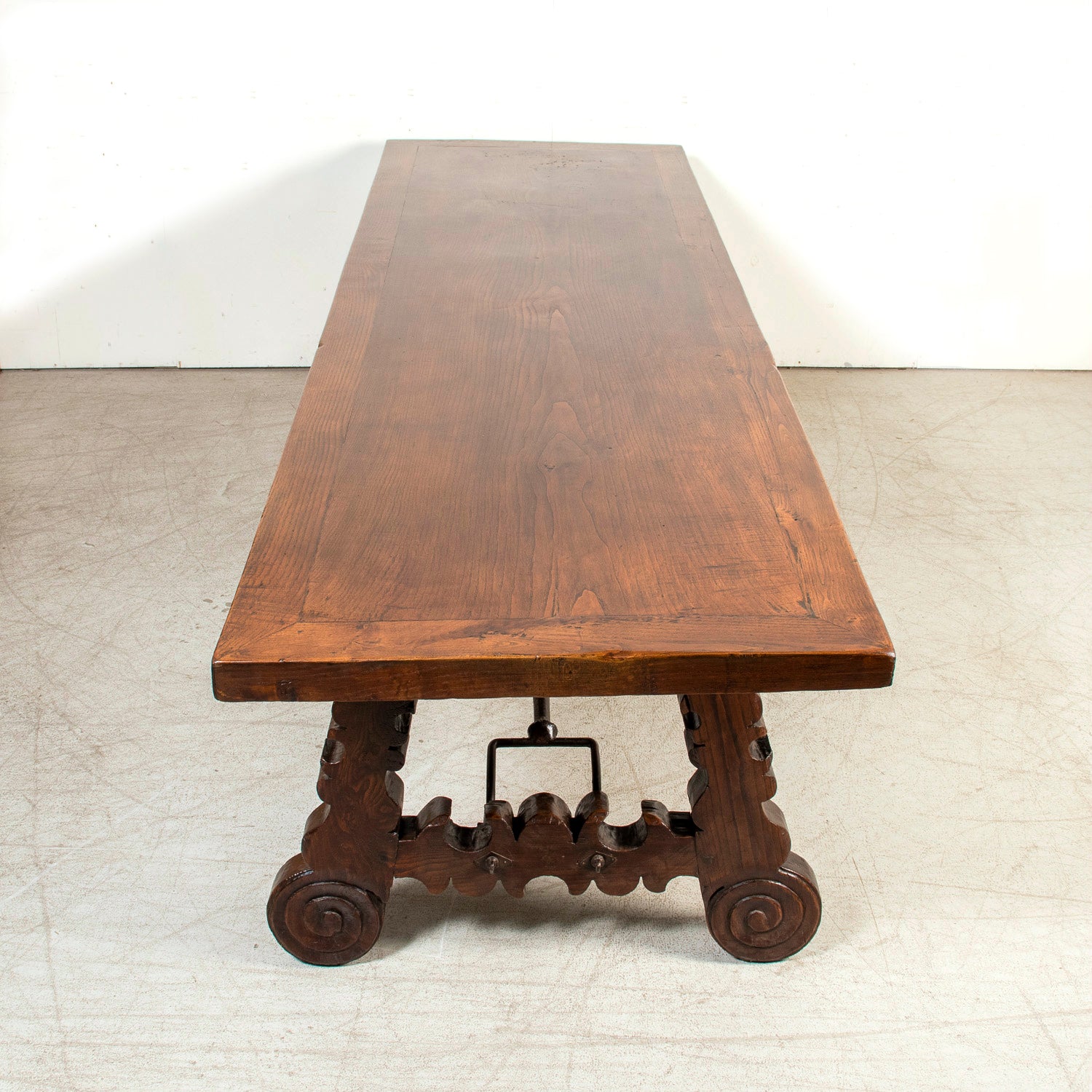 Mid-19th Century Spanish Catalan Carved Oak Dining Trestle Table with Hand Forged Iron Stretcher