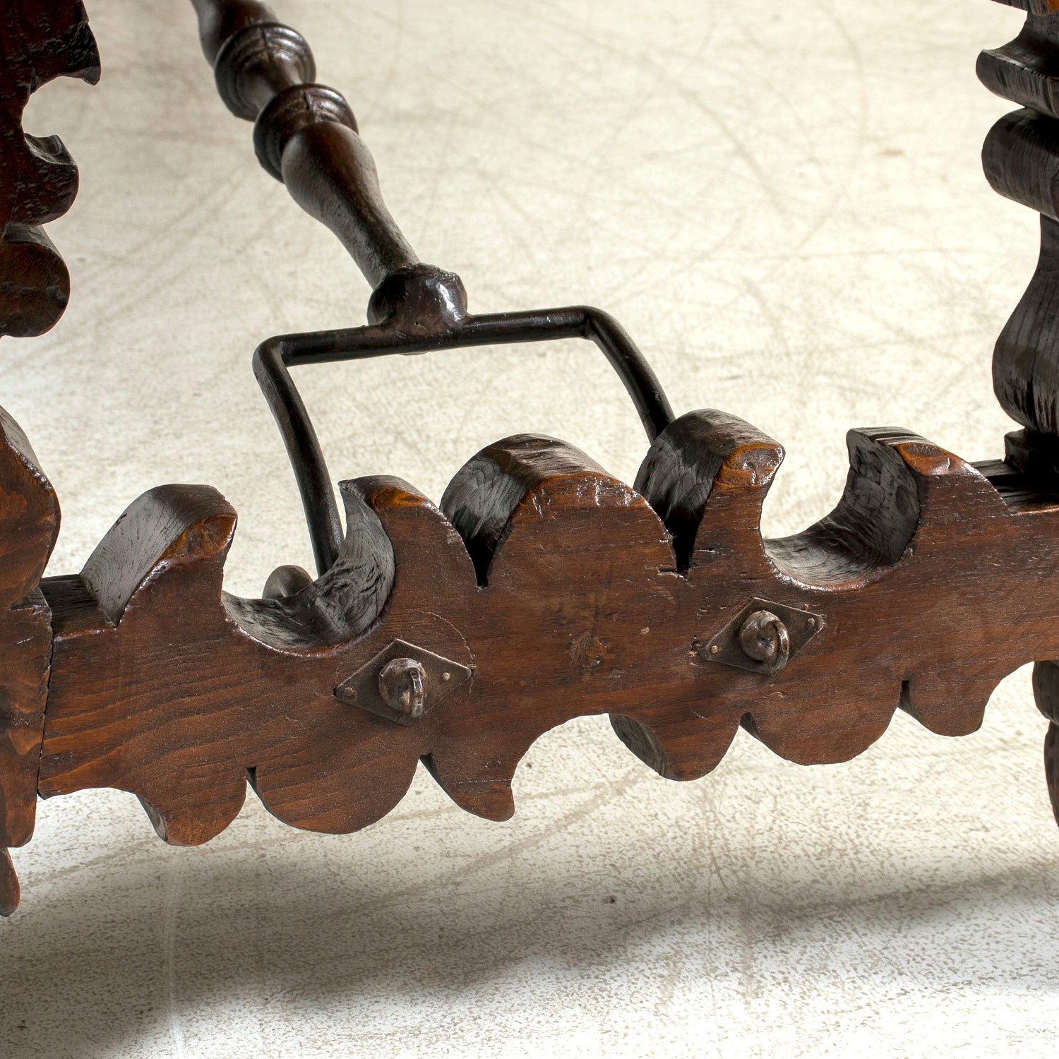Mid-19th Century Spanish Catalan Carved Oak Dining Trestle Table with Hand Forged Iron Stretcher