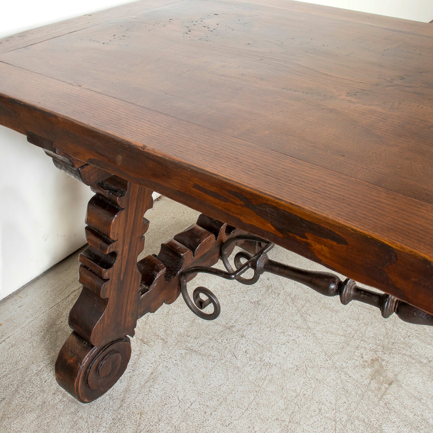Mid-19th Century Spanish Catalan Carved Oak Dining Trestle Table with Hand Forged Iron Stretcher
