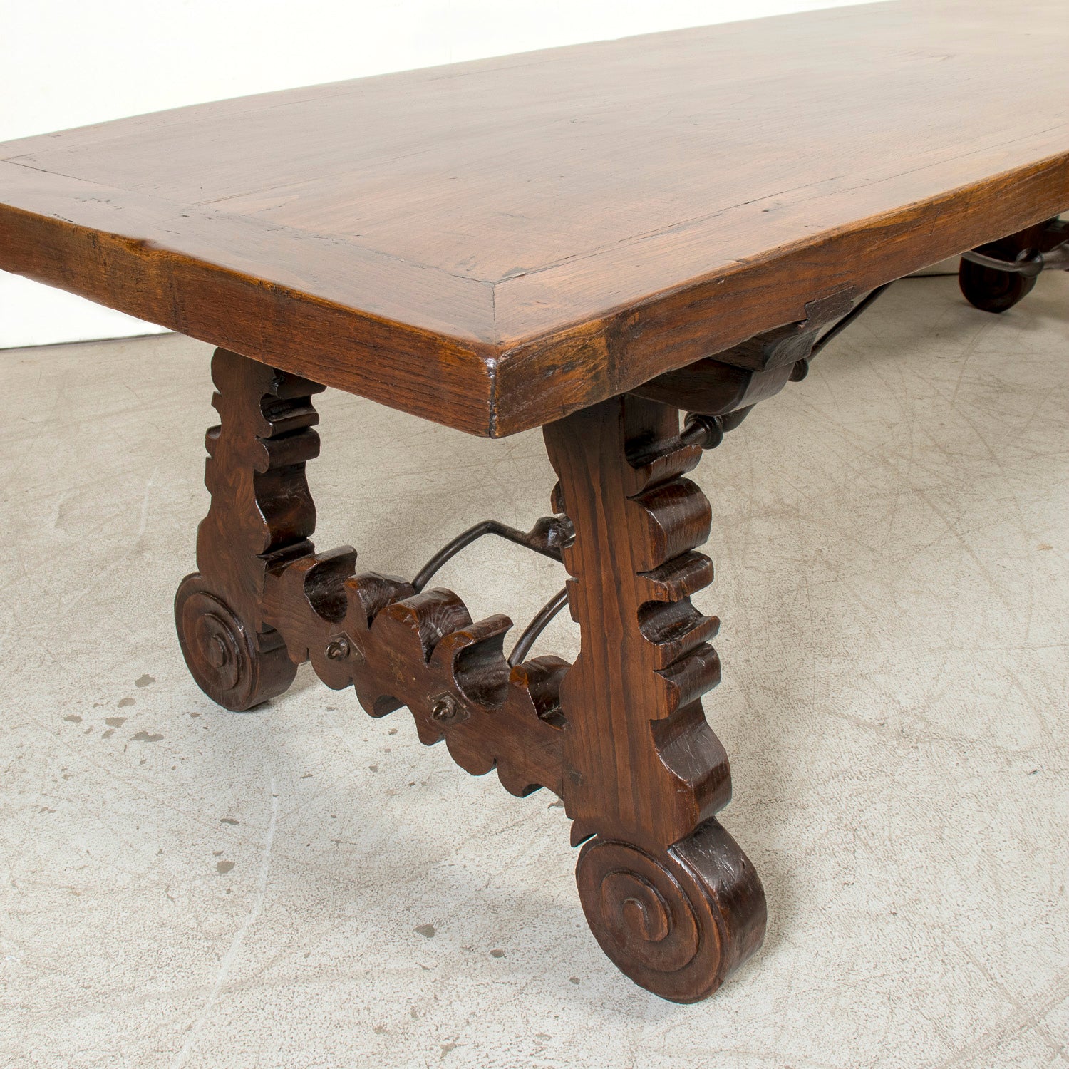 Mid-19th Century Spanish Catalan Carved Oak Dining Trestle Table with Hand Forged Iron Stretcher