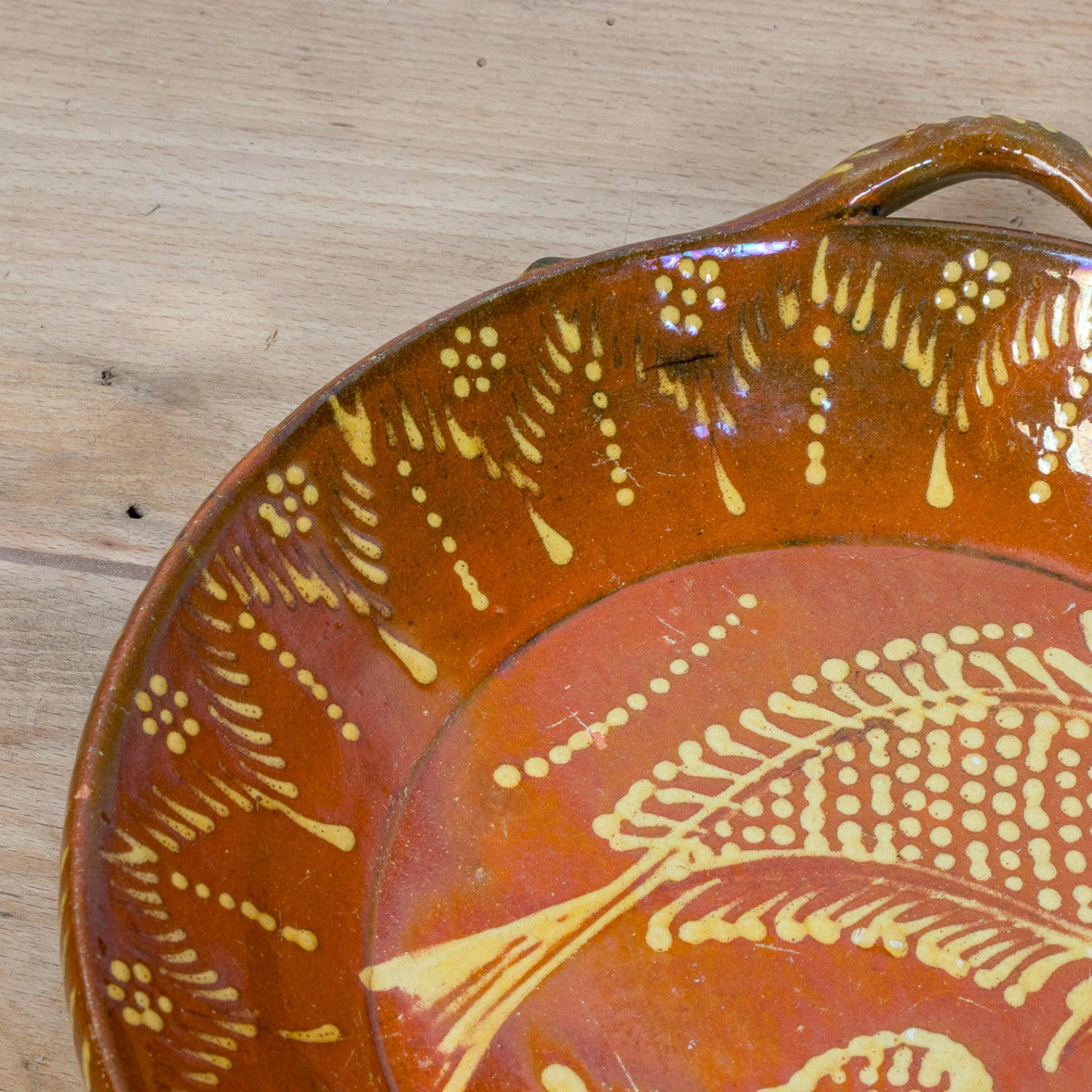 19th Century Portuguese Red Slipware Round Serving Dish with Fish and Leaf Motifs