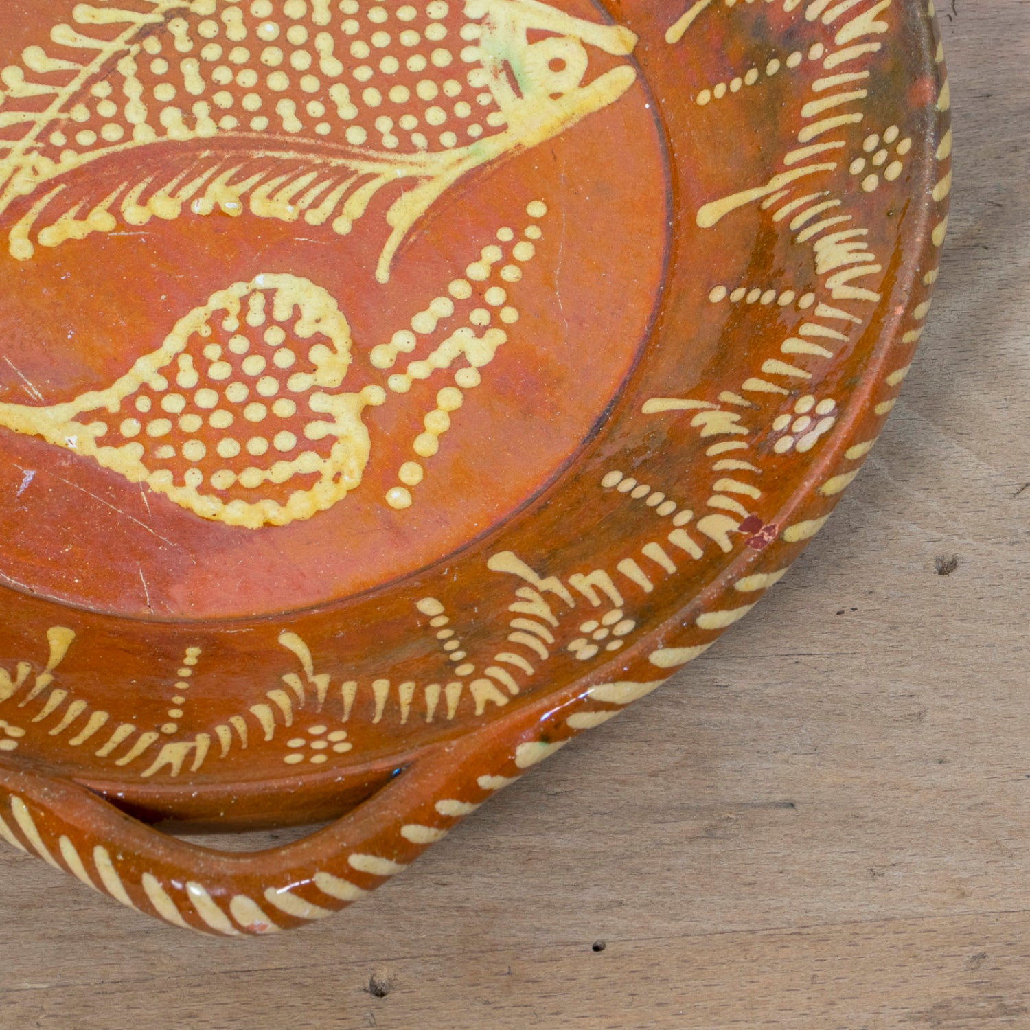 19th Century Portuguese Red Slipware Round Serving Dish with Fish and Leaf Motifs