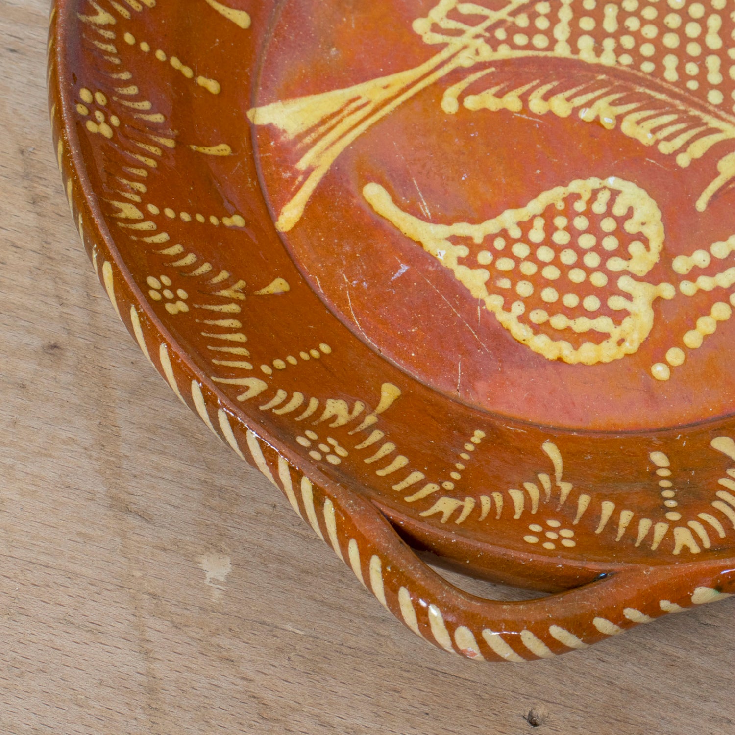 19th Century Portuguese Red Slipware Round Serving Dish with Fish and Leaf Motifs