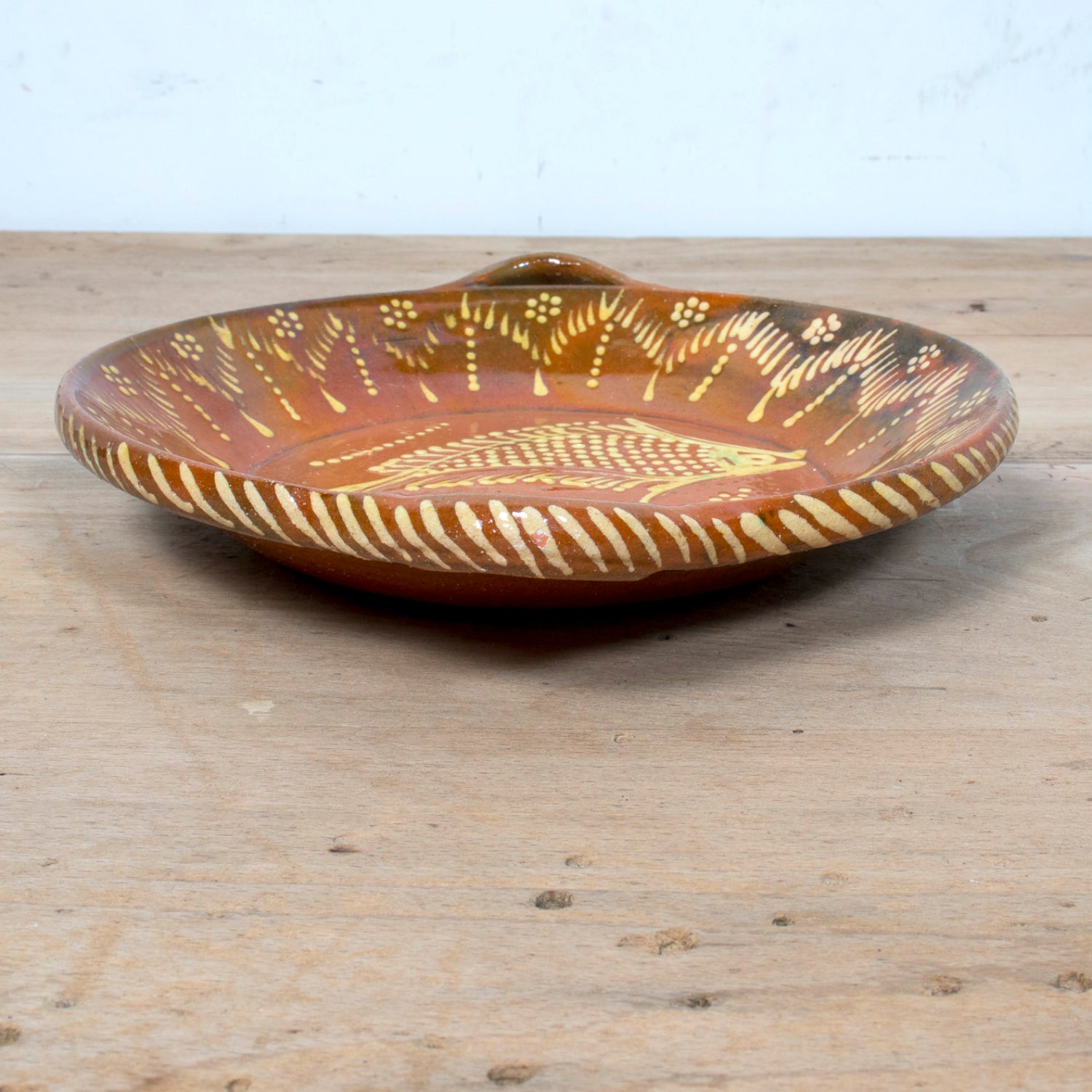 19th Century Portuguese Red Slipware Round Serving Dish with Fish and Leaf Motifs