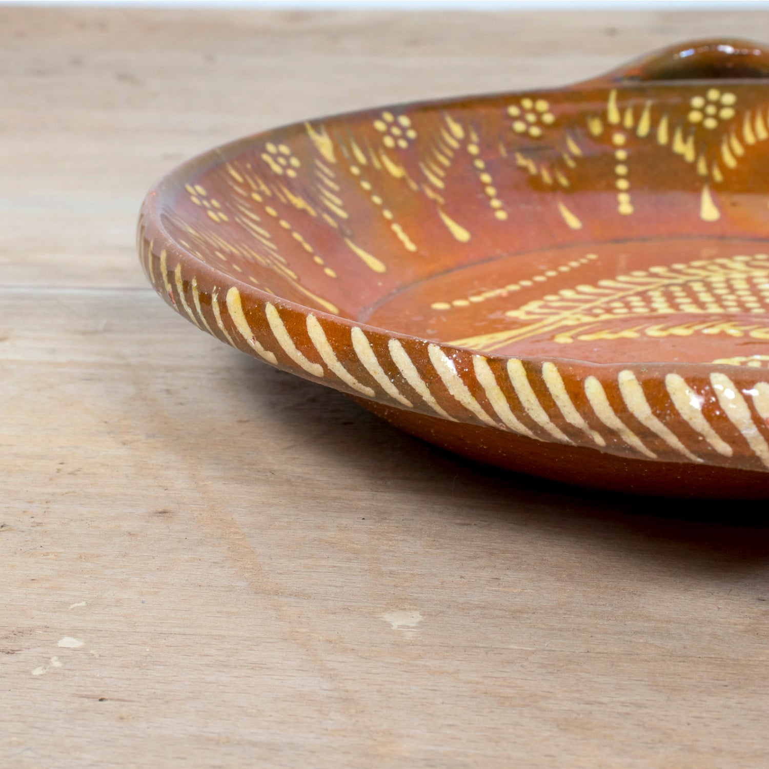 19th Century Portuguese Red Slipware Round Serving Dish with Fish and Leaf Motifs