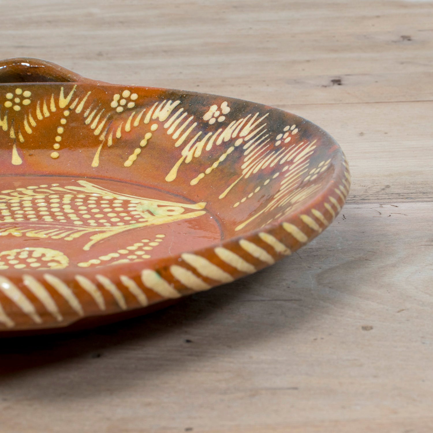 19th Century Portuguese Red Slipware Round Serving Dish with Fish and Leaf Motifs