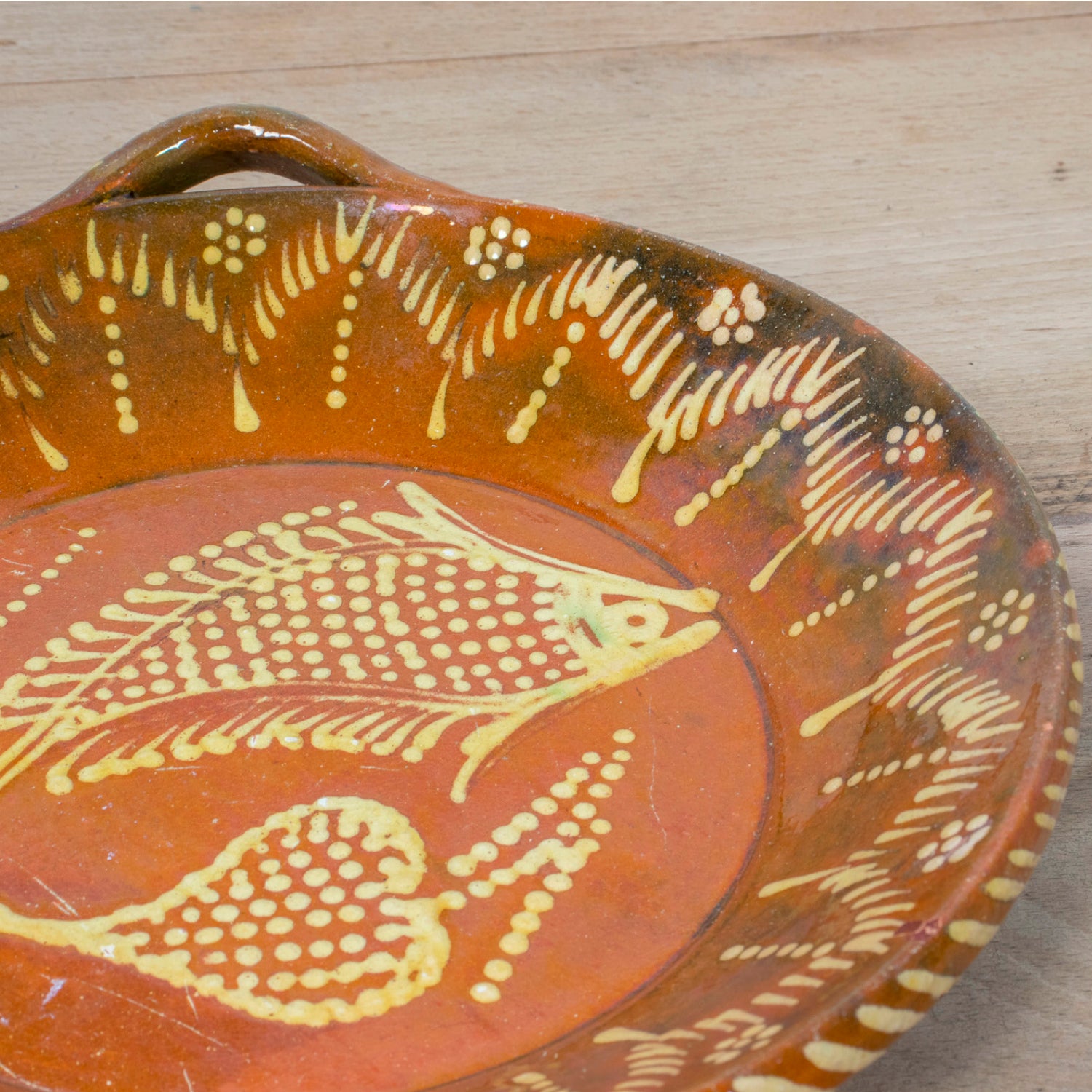 19th Century Portuguese Red Slipware Round Serving Dish with Fish and Leaf Motifs