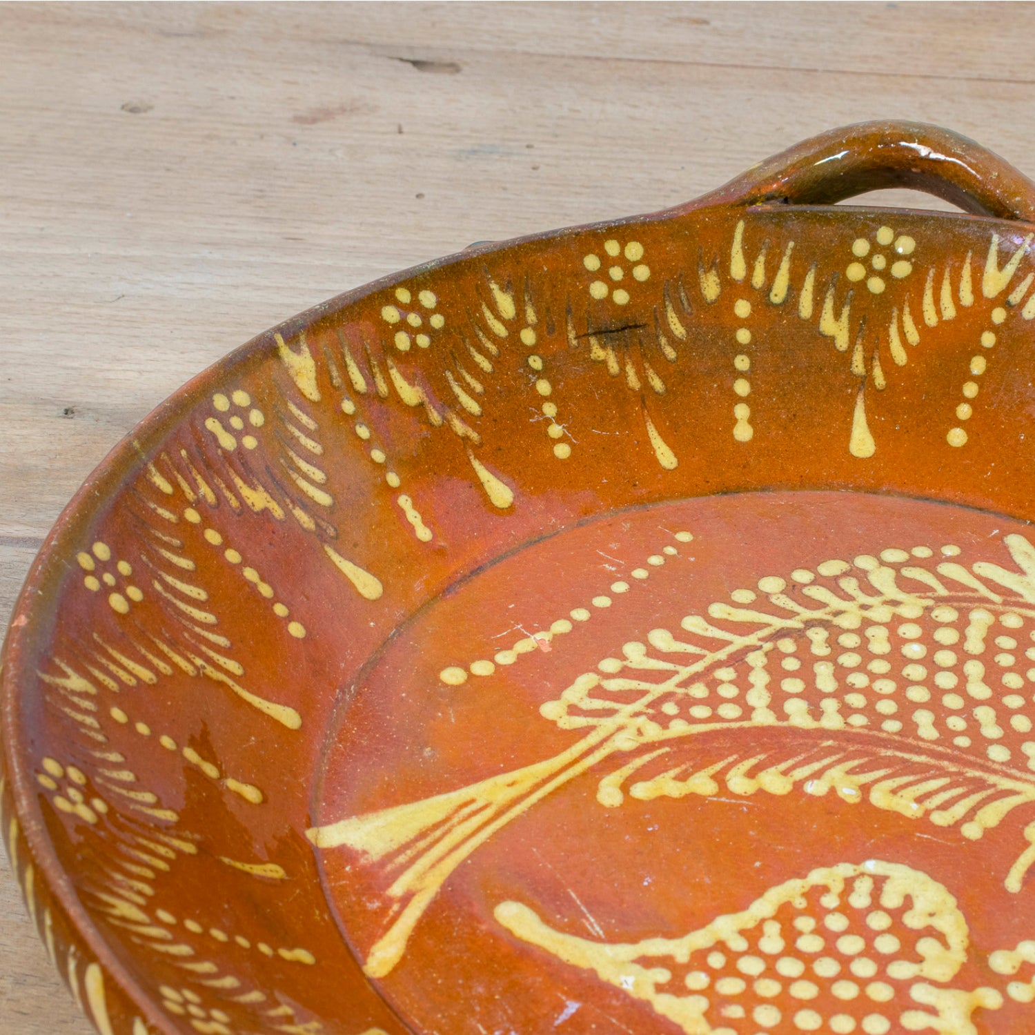 19th Century Portuguese Red Slipware Round Serving Dish with Fish and Leaf Motifs