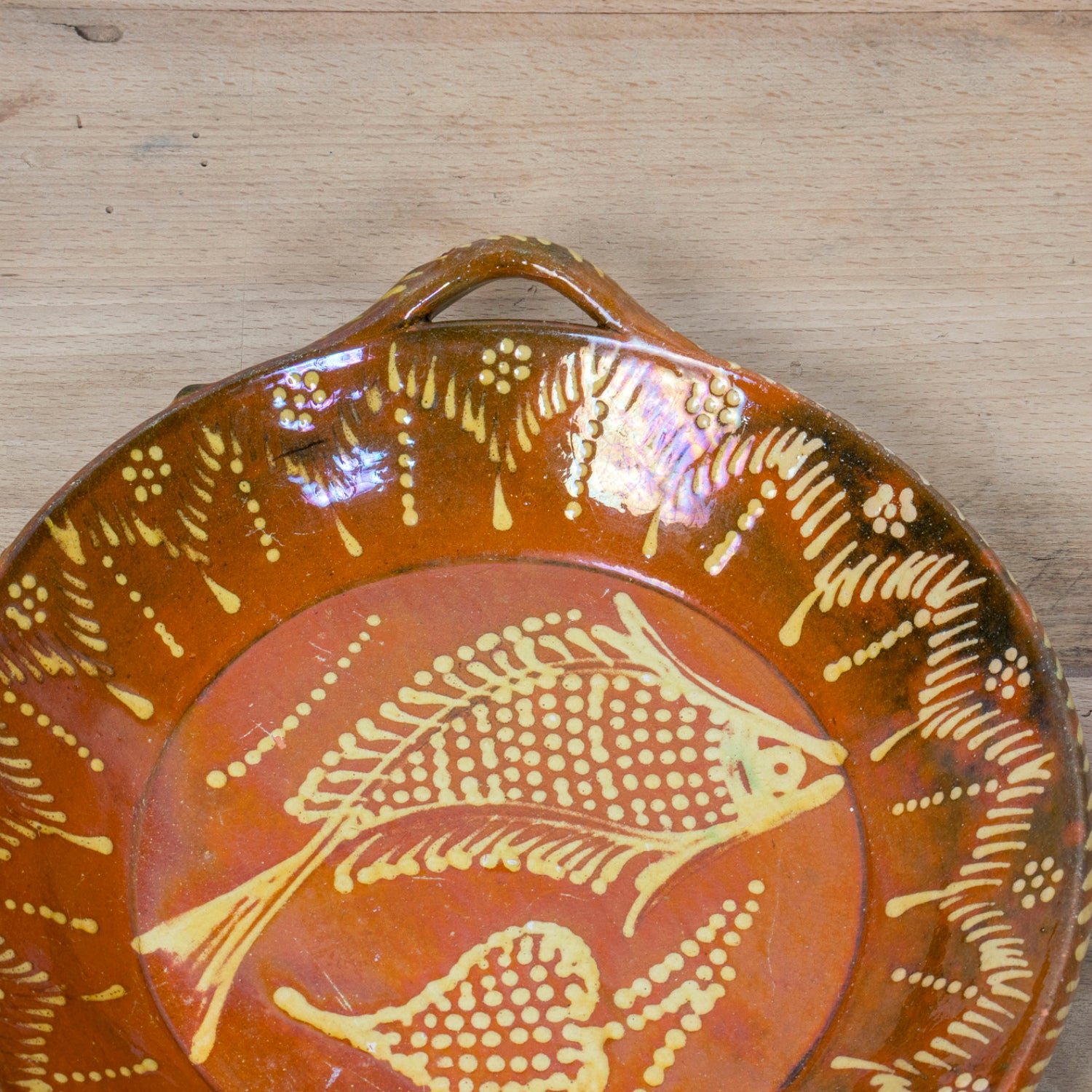19th Century Portuguese Red Slipware Round Serving Dish with Fish and Leaf Motifs